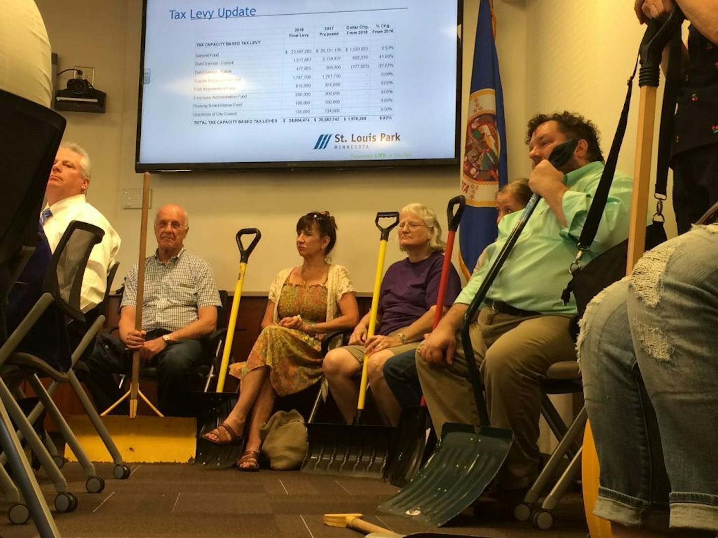 St. Louis Park residents gathered at City Hall to protest the city's sidewalk snow removal policy.