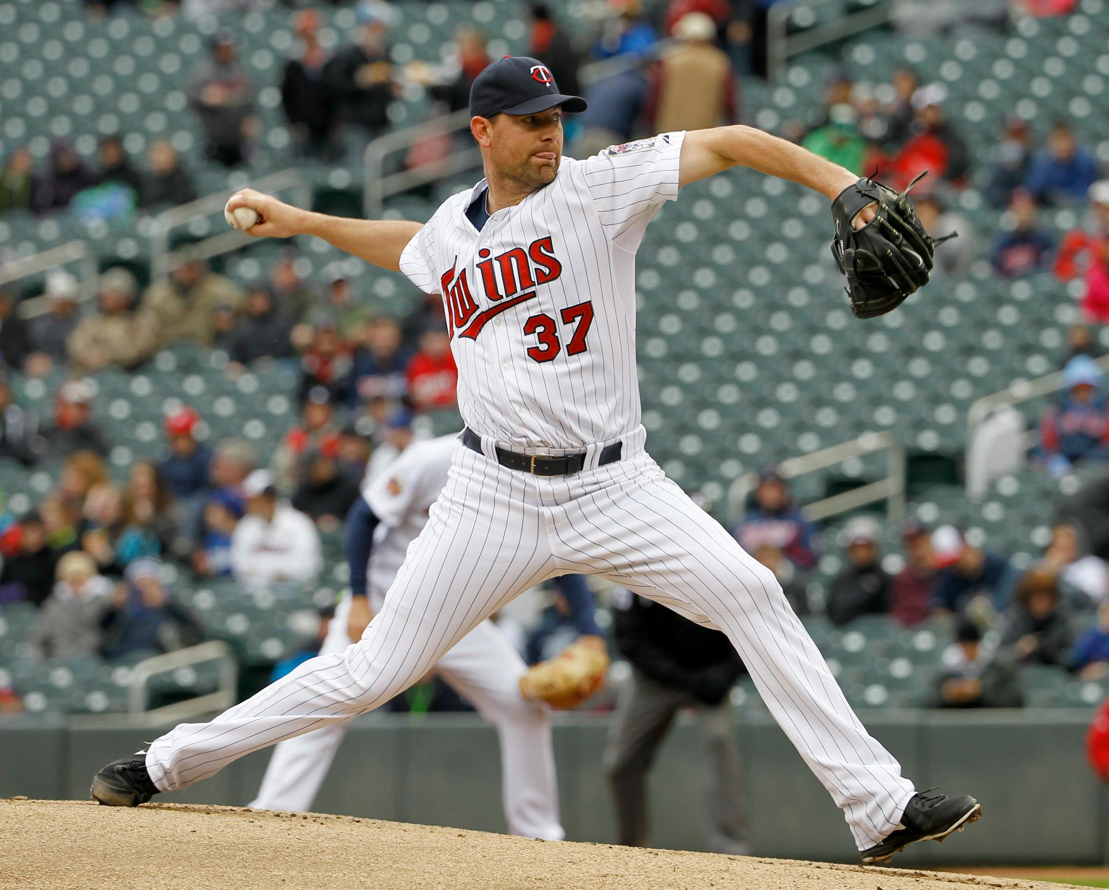 Minnesota Twins starting pitcher Mike Pelfrey (37) delivers to the Los Angeles Dodgers during the first inning in the first baseball game of a doubleheader in Minneapolis, Thursday, May 1, 2014. (AP Photo/Ann Heisenfelt)