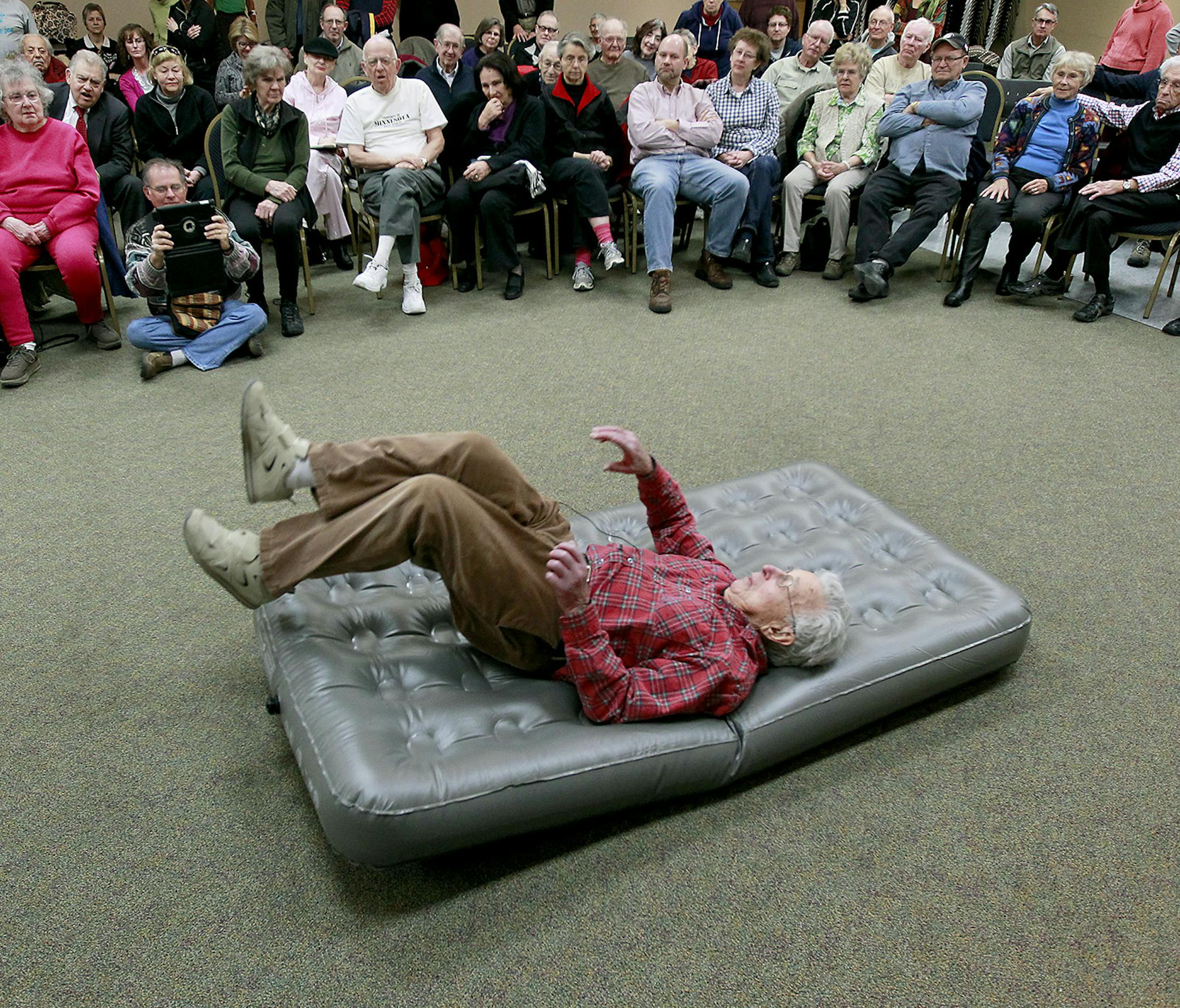 Elliott Royce, 94, demonstrated how to fall to a group of seniors at the Sabes Jewish Community Center, Thursday, February 12, 2015 in St. Louis Park, MN. Royce estimates that he has fallen down at least 14,000 times to teach people -- primarily seniors -- how to fall safely if they are undone by slippery sidewalks. ] (ELIZABETH FLORES/STAR TRIBUNE) ELIZABETH FLORES • eflores@startribune.com