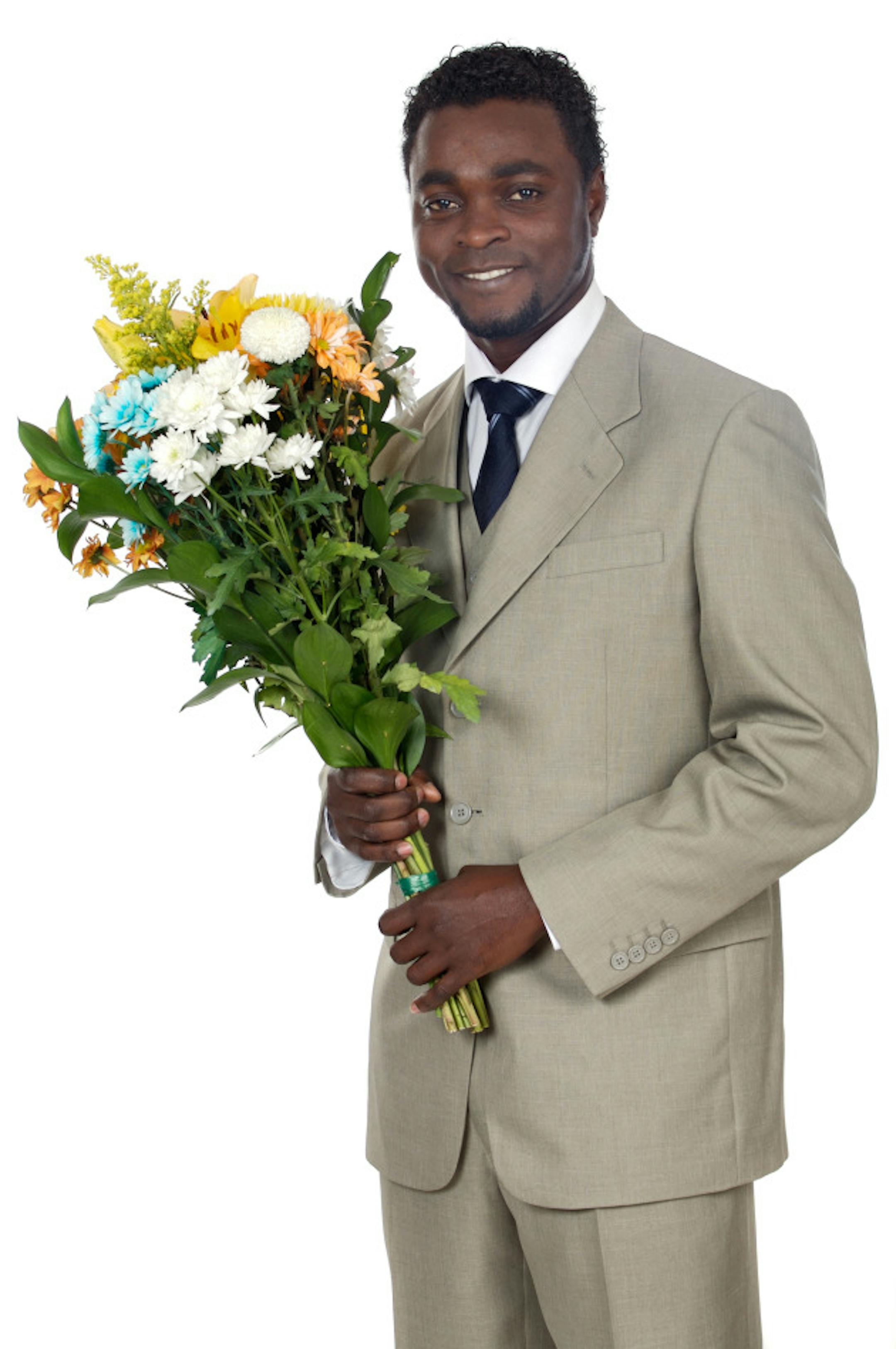 Copyright:  Gelpi Shutterstock, Inc. "Attractive black man holding flowers"