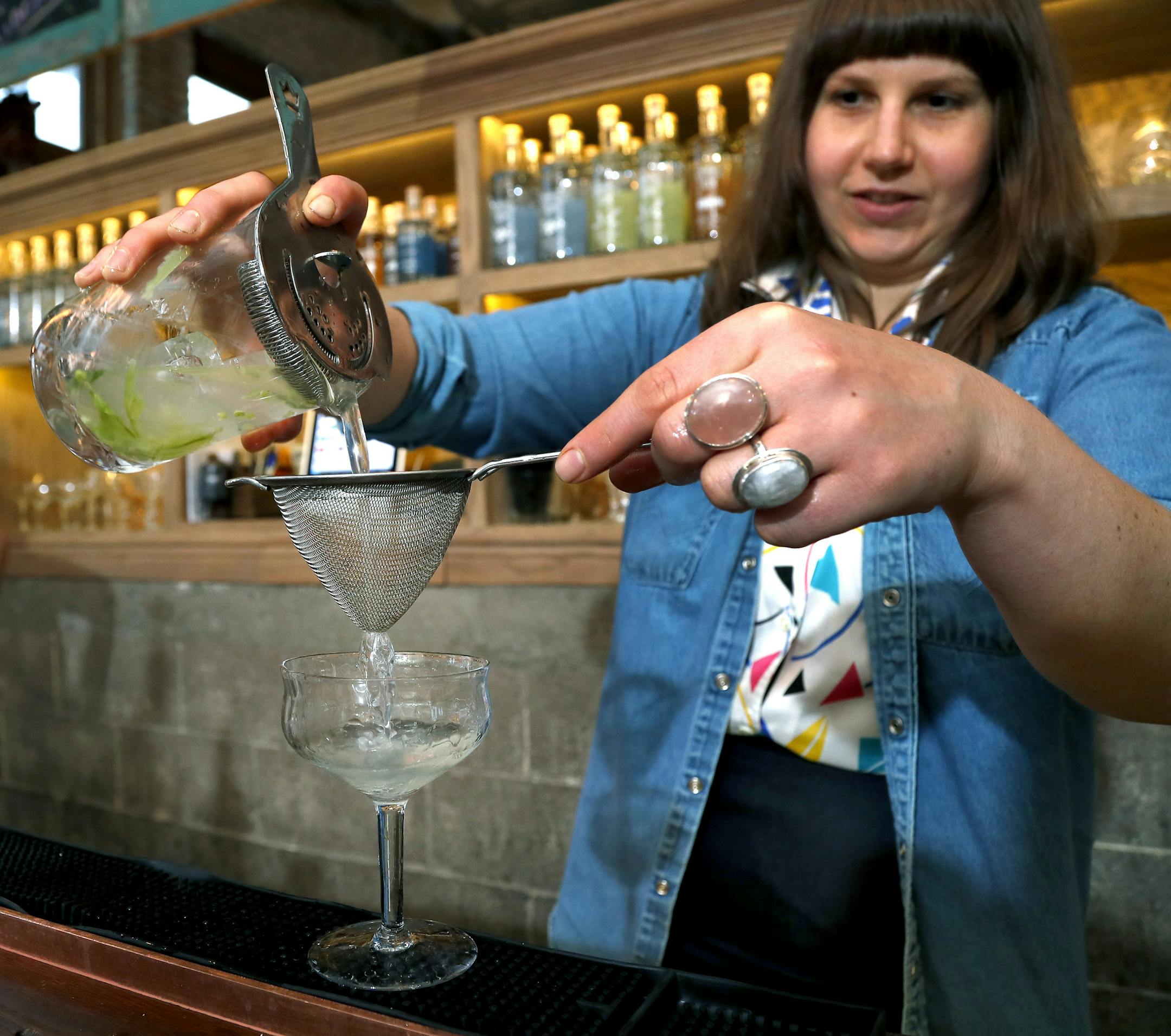 Bartender Hally Sharrow prepared a drink at Vikre Distillery. Vikre just won in the Spirits category of the Good Food Awards.