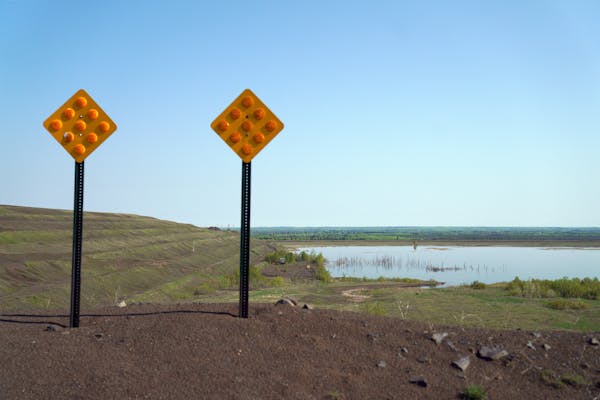 The PolyMet tailings ponds could be seen over a small berm.