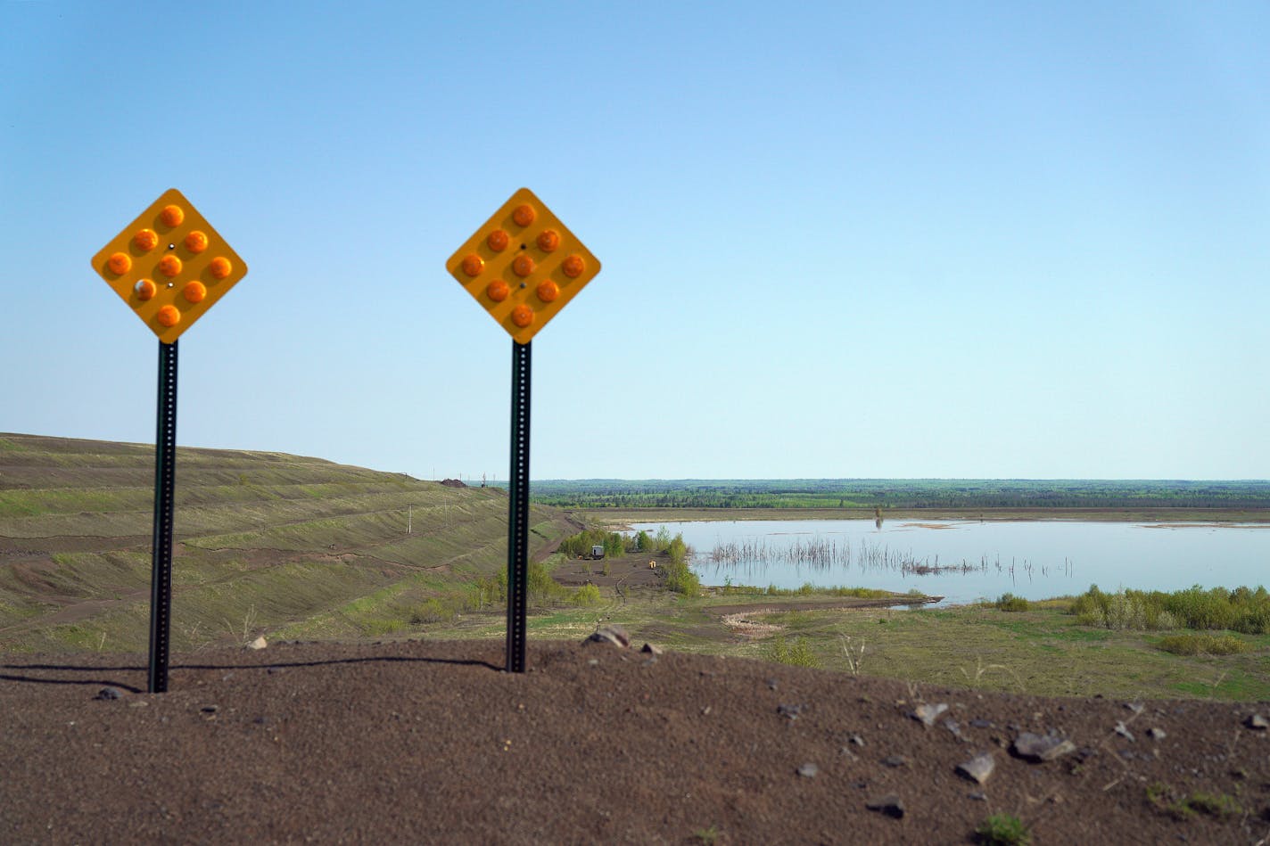 The PolyMet tailings ponds could be seen over a small berm.