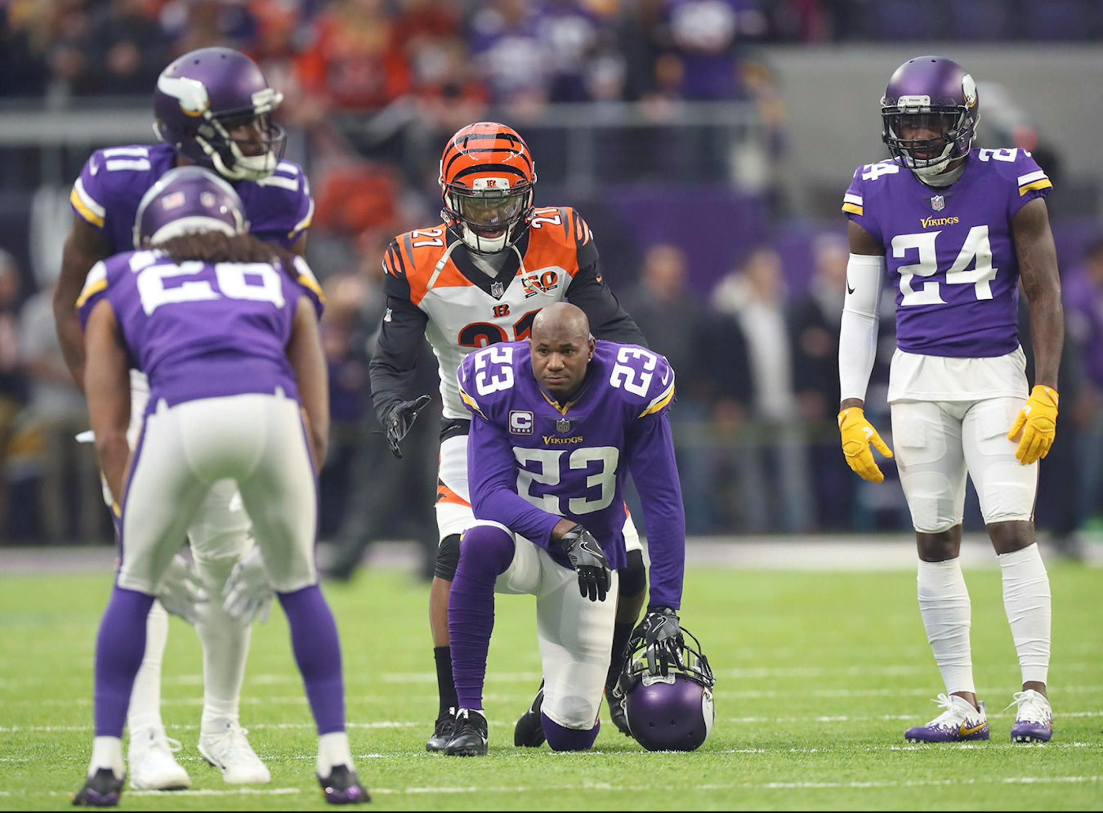 Cincinnati Bengals cornerback Darqueze Dennard (21) sneaked up on Minnesota Vikings cornerback Terence Newman (23) to say hello before the two teams met Sunday.