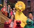 This image released by HBO shows the cast of the popular children's show "Sesame Street." Big Bird, Elmo and stars of &#x201c;Sesame Street&#x201d; ar