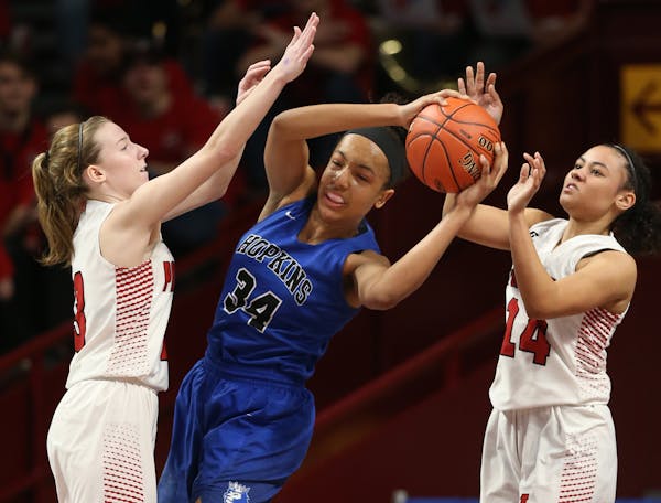 Maya Nnaji(34) of Hopkins tries to break the press from Abby Ruhland(13) and Sarah Kuma(14). ] Hopkins takes on Lakeville North in the quaterfinals of
