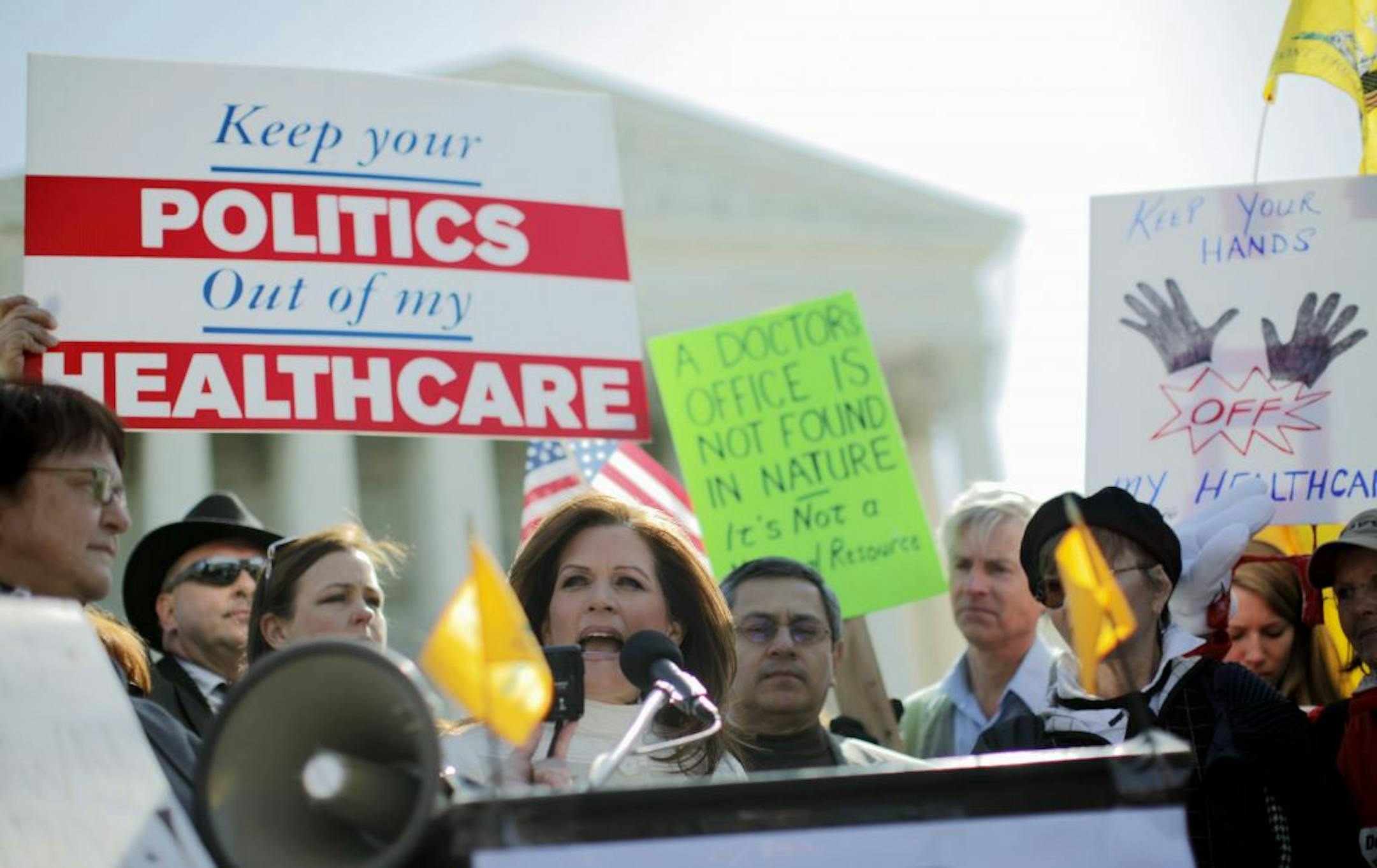 Rep. Michele Bachmann, R-Minn., addressed Tea Party supporters and opponents of health care reform Tuesday in front of the Supreme Court in Washington. The court was hearing arguments on the constitutionality of a provision in the health care law passed by Congress in 2010.