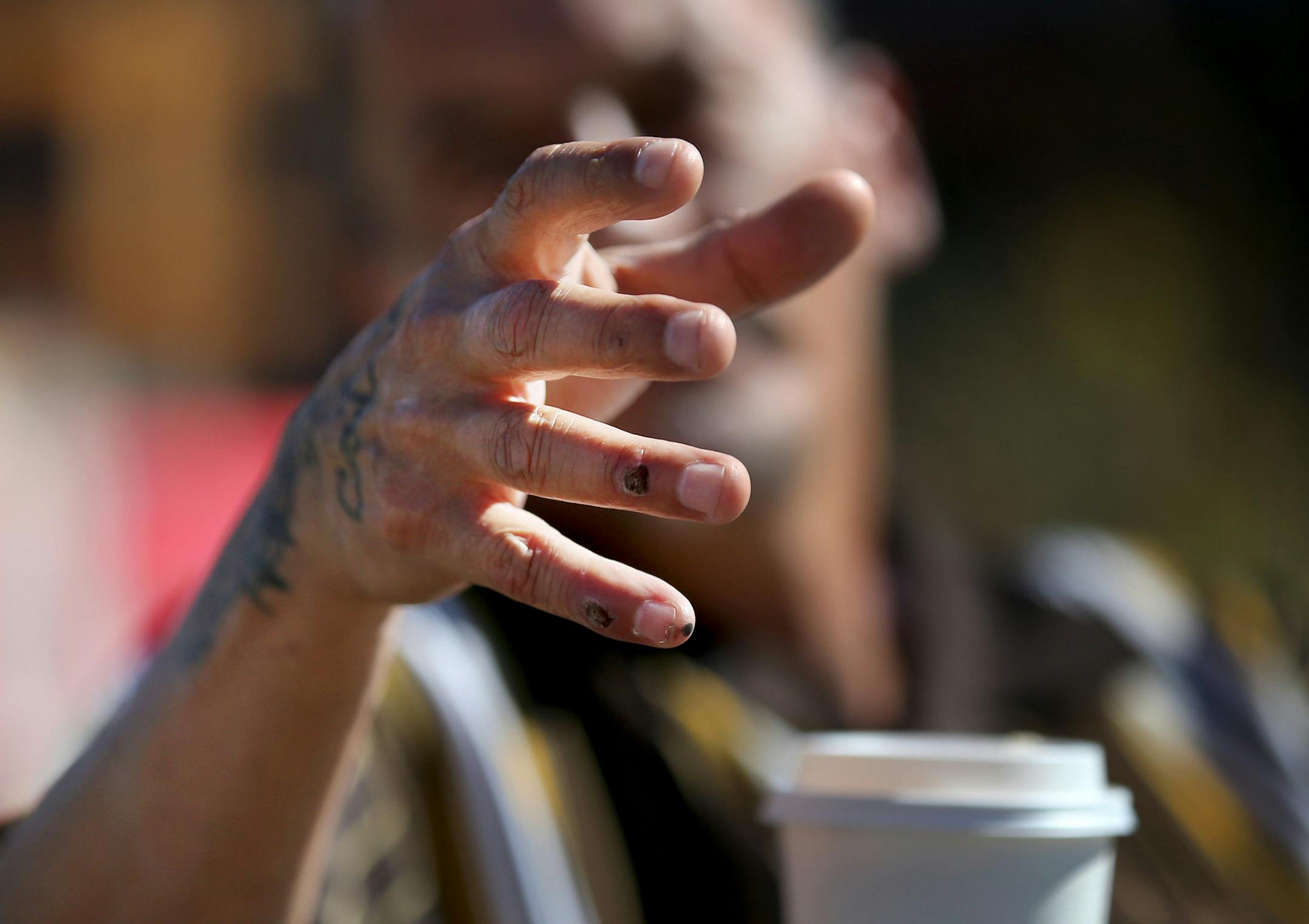 James Cross, the founder of the street outreach group Natives Against Heroin, spent nearly half of his life in prison for drug-related crimes. Here, scabs cover Cross' fingers where he had been injured recently breaking up a fracas in a growing homeless encampment that is patrolled by NAH and seen Wednesday, Sept. 5, 2018, in south Minneapolis, MN.] DAVID JOLES ï david.joles@startribune.com James Cross, the founder of the street outreach group Natives Against Heroin, spent nearly half of his lif