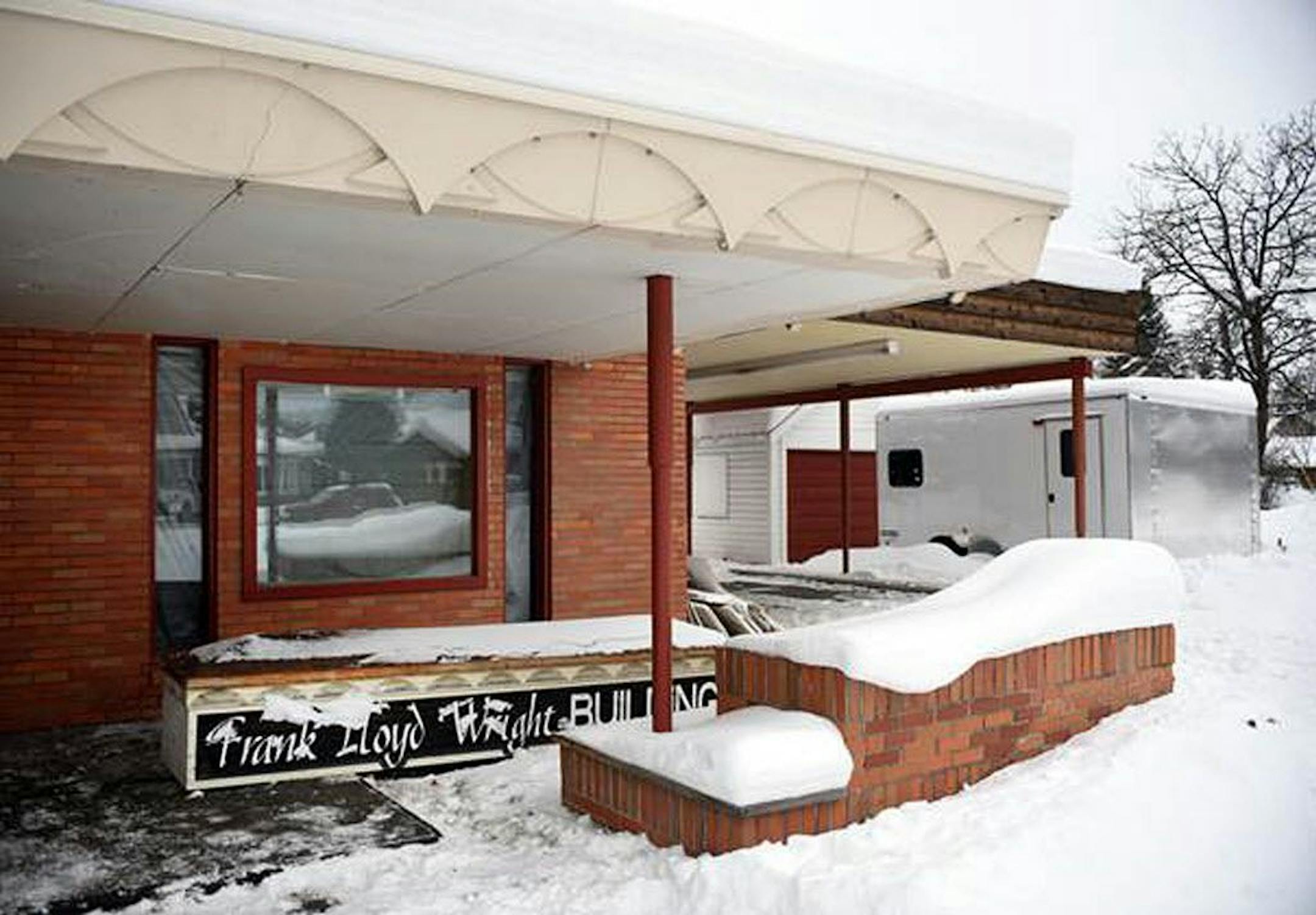 This recent but undated photo shows demolition of the Frank Lloyd Wright Building underway in Whitefish, Mont. Currently the work is being done on the inside, though the sign that stood on the exterior has been taken down. The Frank Lloyd Wright Building Conservancy is trying to prevent the commercial building in northwestern Montana designed by the famed architect from being demolished. The Chicago-based conservancy is trying to find someone to pay $1.7 million for the former medical center, de