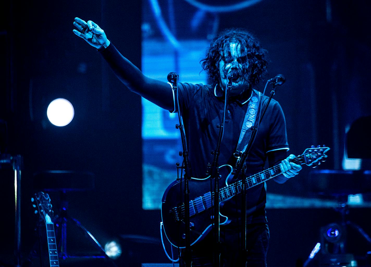 Jack White waves to the crowd as he sings his opening songs.