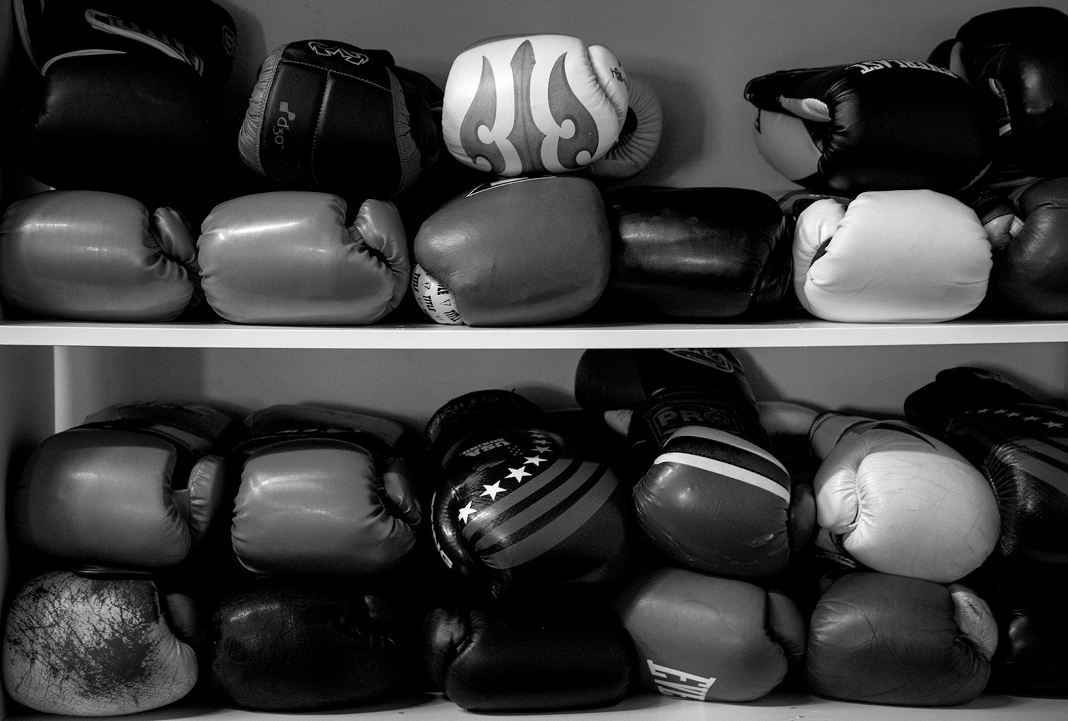 Boxing gloves stacked at The Minneapolis Boxing Club.
