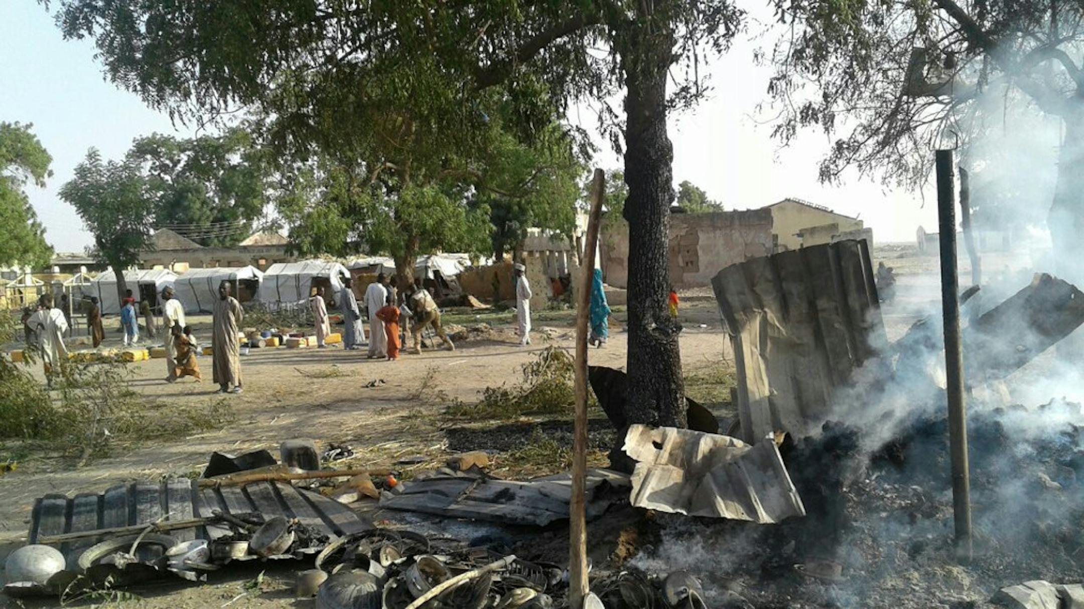 Smoke rises from a burnt out shelter at a camp for displaced people in Rann, Nigeria, Tuesday Jan. 17, 2017.
