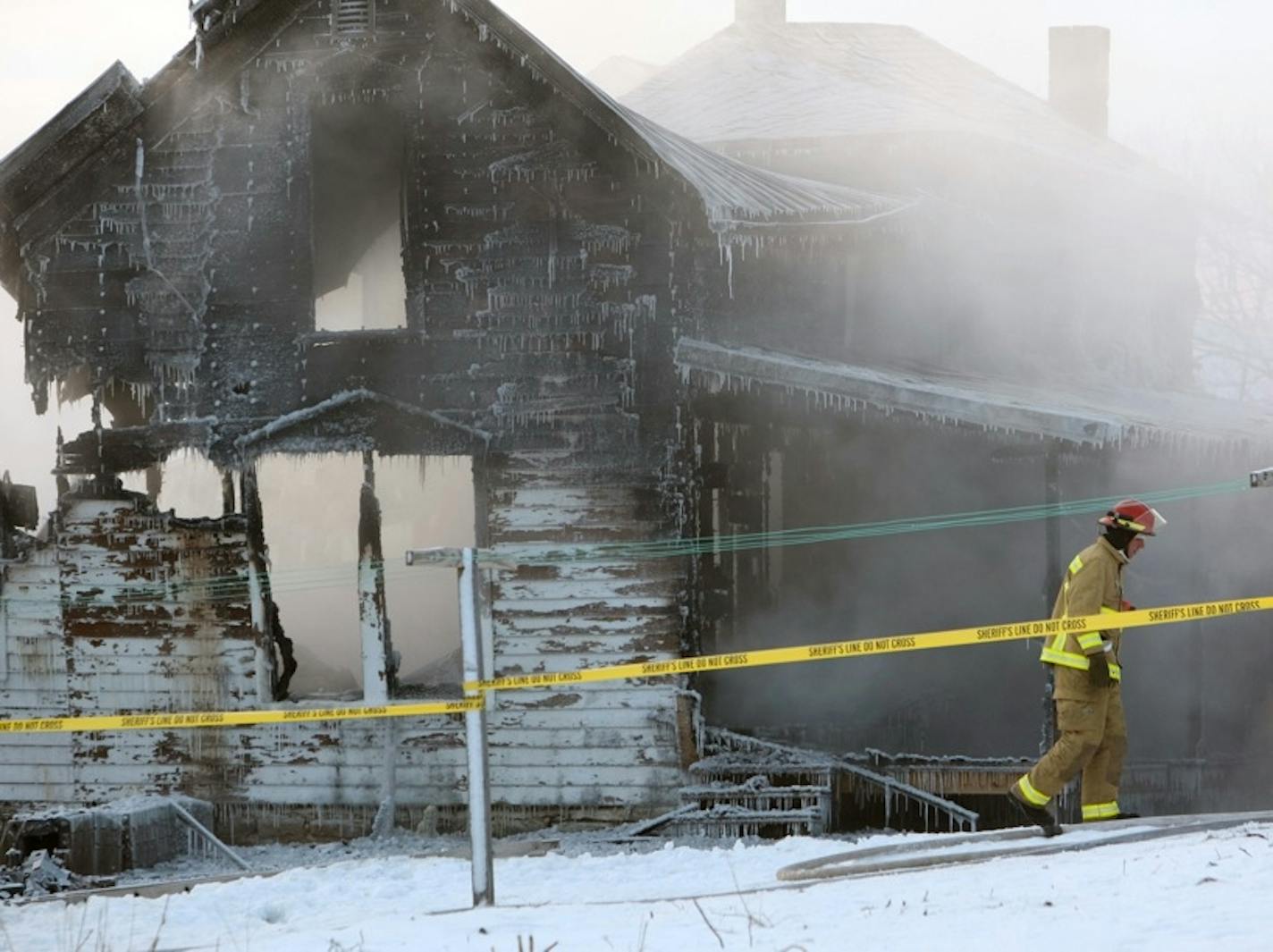 Fire raged burned a rural home near Canton, MN, early today, sending two people to the hospital and leaving two family members missing.