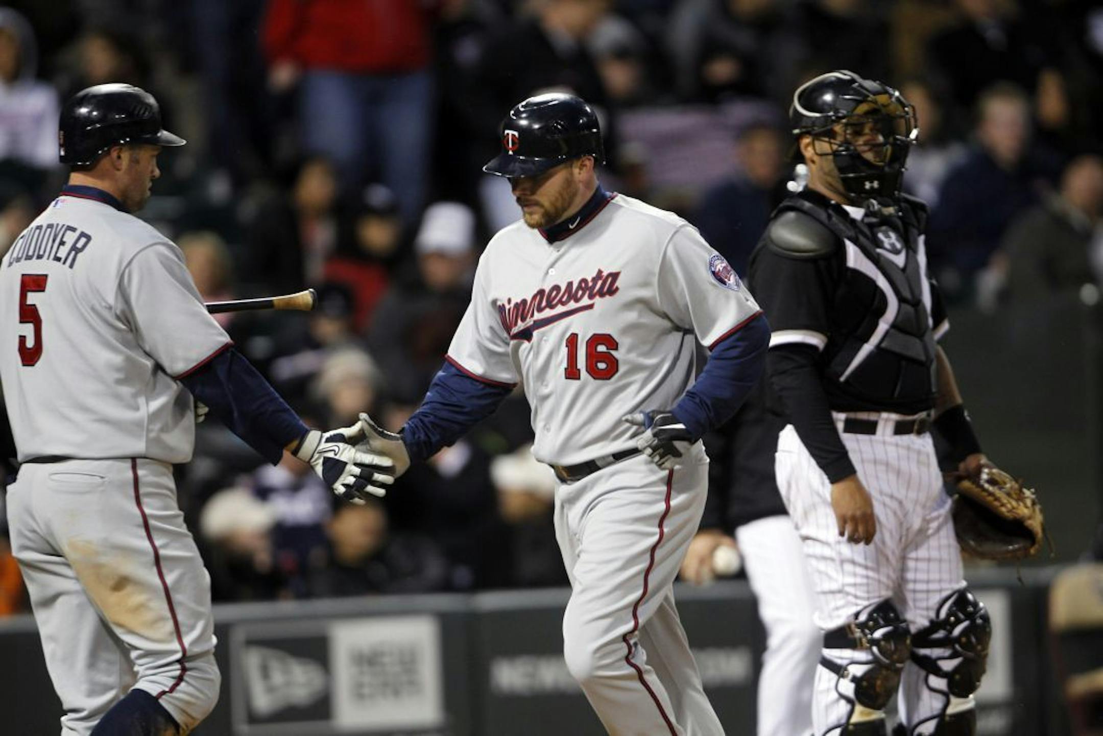 Minnesota Twins' Jason Kubel (16) and Michael Cuddyer.