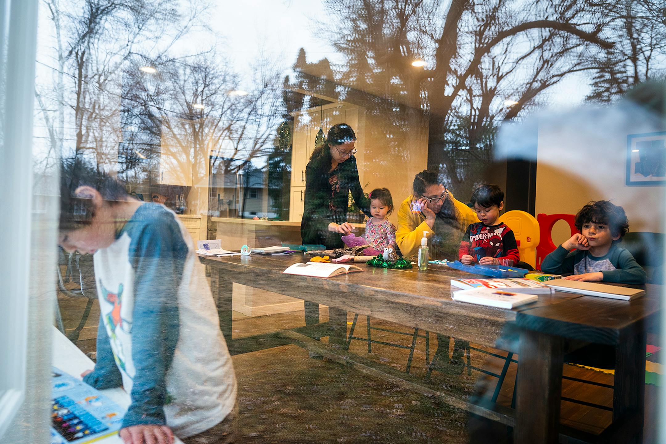 Andrea Royce, from top, homeschooled her children Rowan, from left, 6, Lucy, 1, and Parker, 4, with the help of a friend that helps with childcare Carlota Bernal, in yellow, with her son Blaze Boxell, far right, 5. Andrea Royce spent time homeschooling her three children with help from her friend that helps with childcare Carlota Bernal at Royce's home in Roseville on Wednesday, March 25, 2020. Parents are taking on the role of educators now that the schools are closed due to the COVID-19 pandem