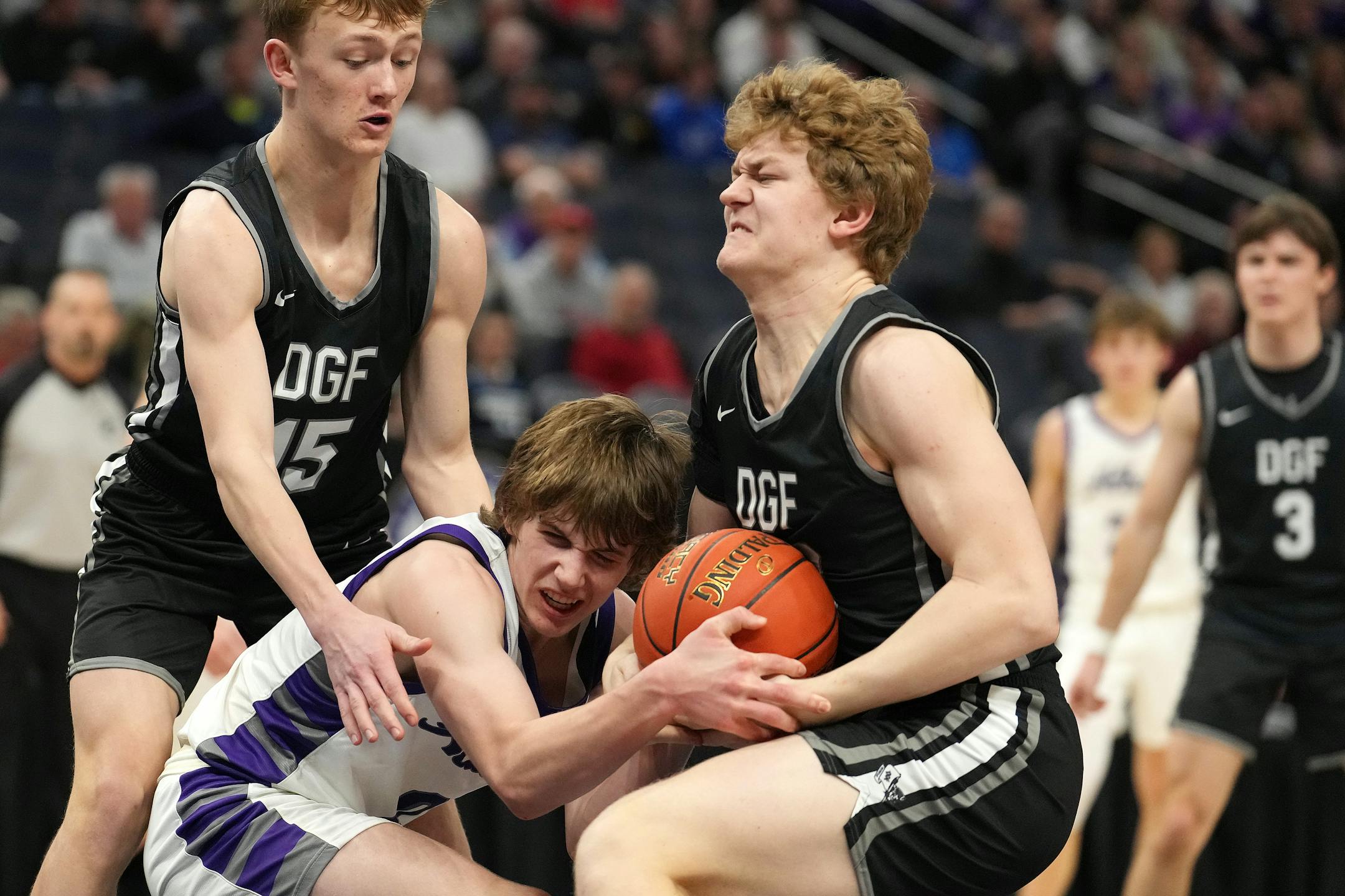 Albany guard Zeke Austin (0) and DGF forward Brody Friend (20) fight for a loose ball in the second half.