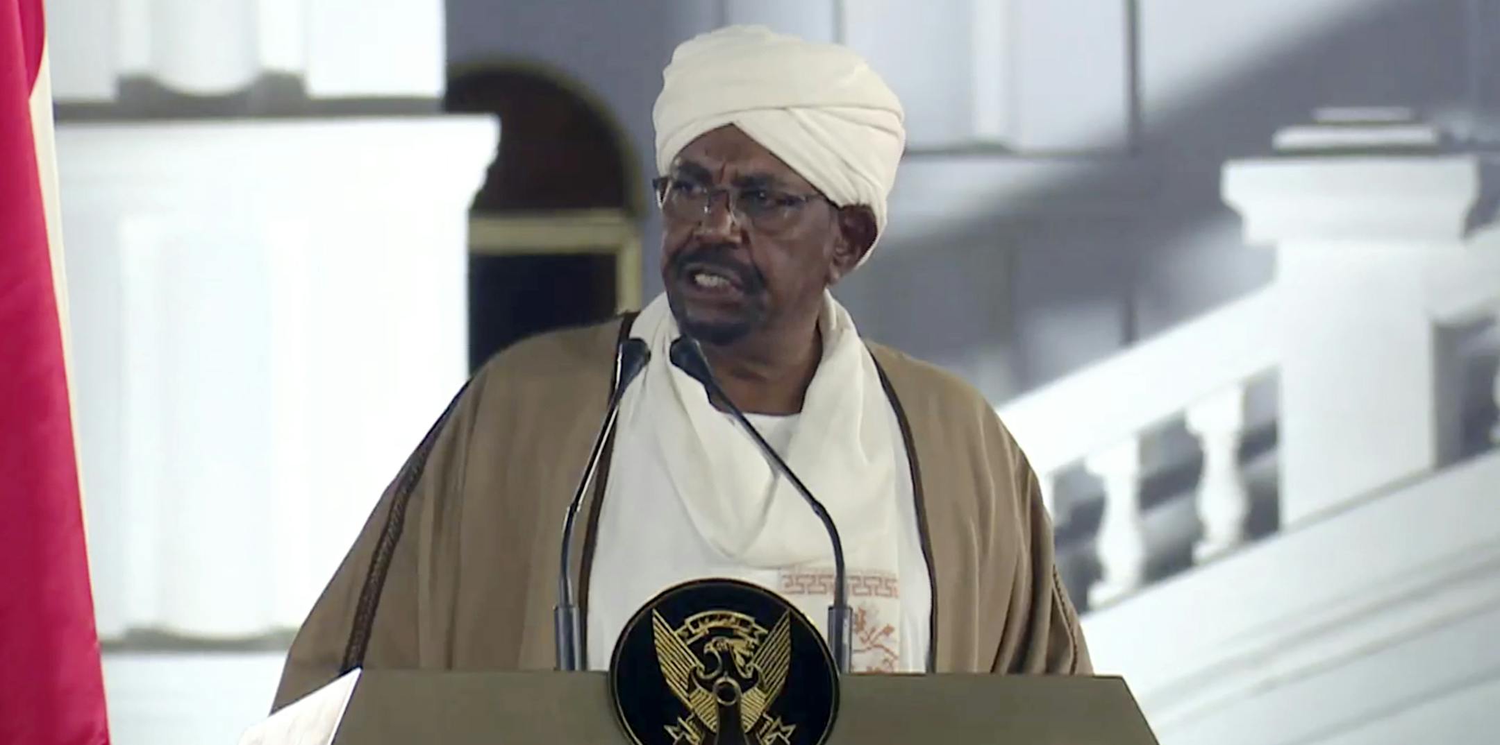 FILE - In this file image taken from video, Sudan's President Omar al-Bashir speaks at the Presidential Palace, Friday, Feb. 22, 2019, in Khartoum, Sudan. Tens of thousands of Sudanese were making their way to the center of the country’s capital on Thursday, April 11, 2019, cheering and clapping in celebration as two senior officials said the military had forced longtime autocratic President Omar al-Bashir to step down after 30 years in power.(AP Photo/Mohamed Abuamrain, File)