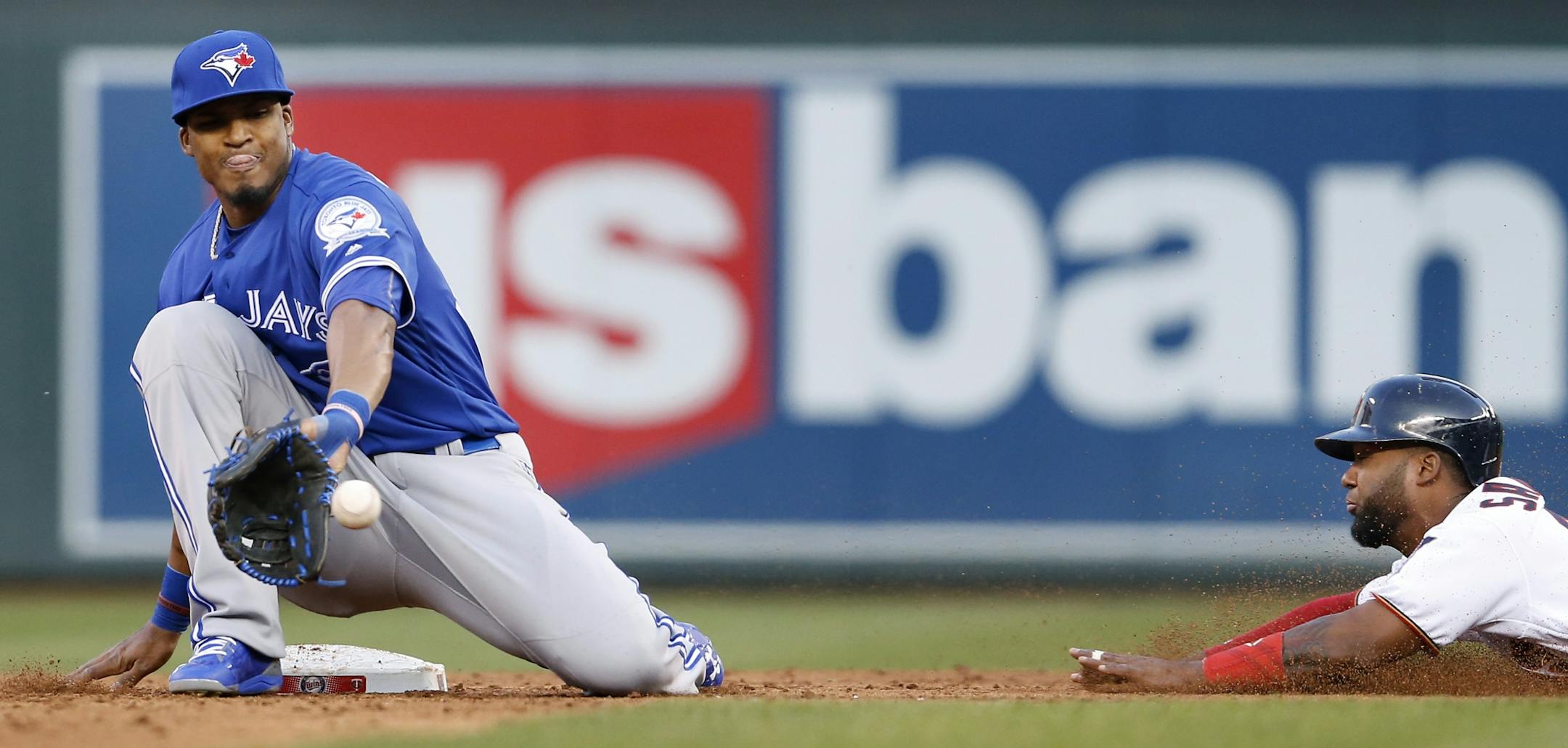Danny Santana beat the tag by Jimmy Paredes (37) while stealing second base in the third inning.