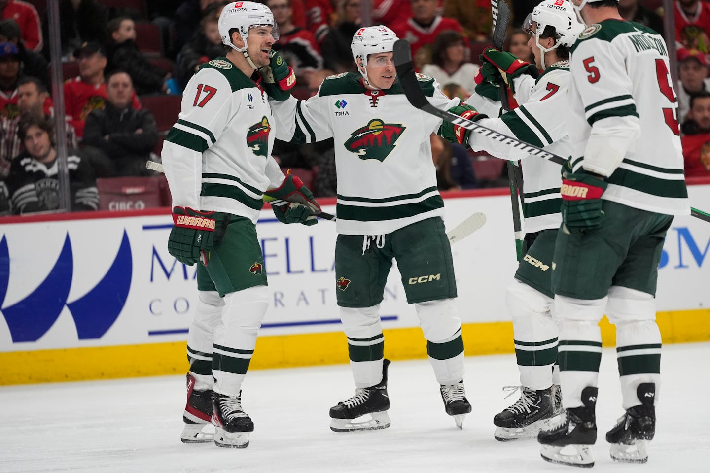 From left, the Wild's Marcus Foligno (17), Vinni Lettieri (10), Brock Faber (7) and Jake Middleton (5) celebrated Foligno's go-ahead goal in the third