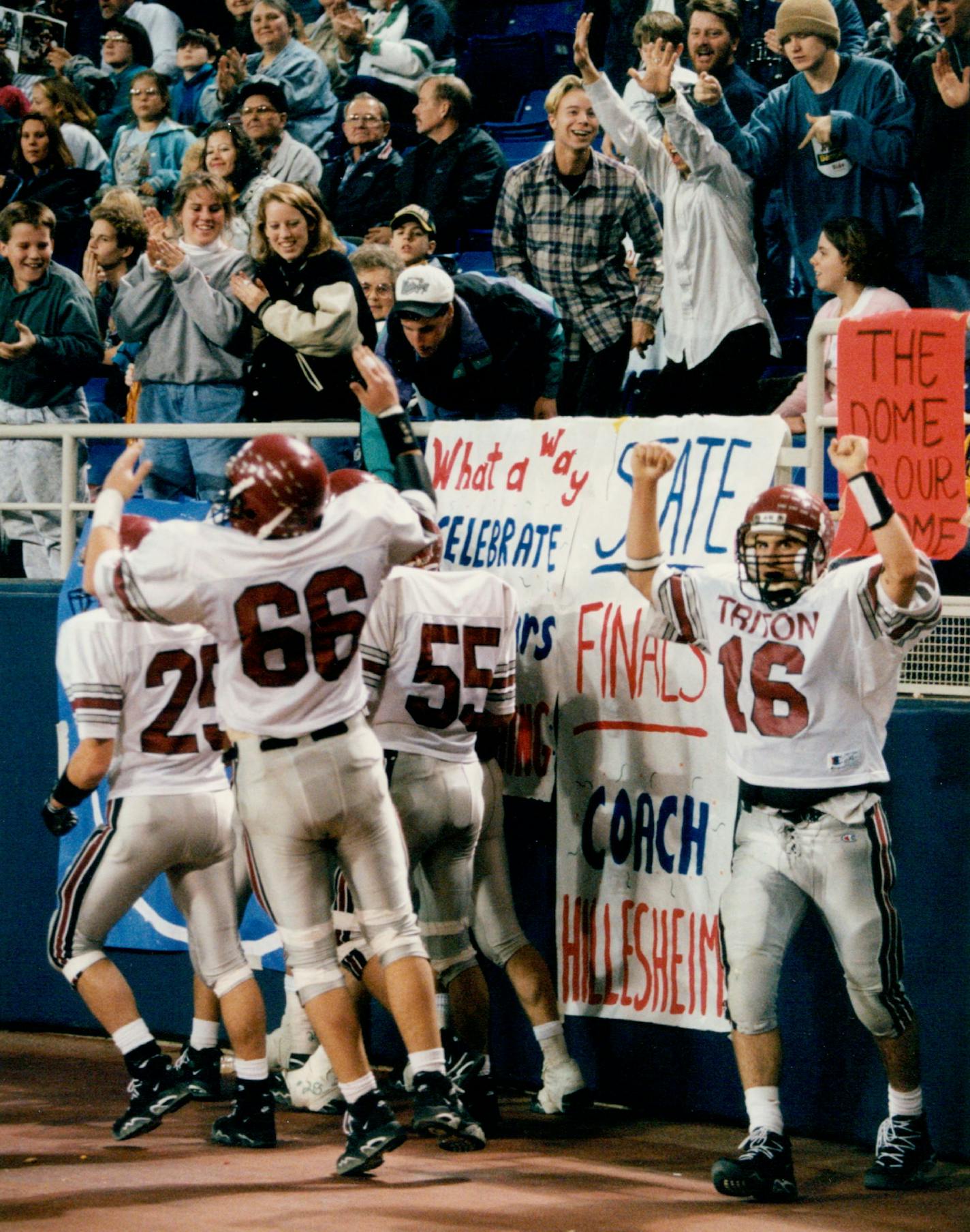 December 25, 1994 Tritons quarterback 16 kirk midthun celebrated with teammates and fans after he threw another touchoown pass to Judge Gisslen in the 4th quarter. November 26, 1994 Bruce Bisping, Minneapolis Star Tribune