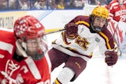 Gophers forward Rhett Pitlick, right, faces Boston University in the 2023 Frozen Four semifinals in Tampa, Fla. That night still weighs on the Terrier
