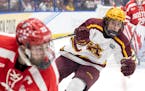 Gophers forward Rhett Pitlick, right, faces Boston University in the 2023 Frozen Four semifinals in Tampa, Fla. That night still weighs on the Terrier