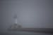 A thick fog covered the Duluth Harbor North Pier Light on Monday afternoon. The fog hung in the air late into the afternoon without ever fully clearin