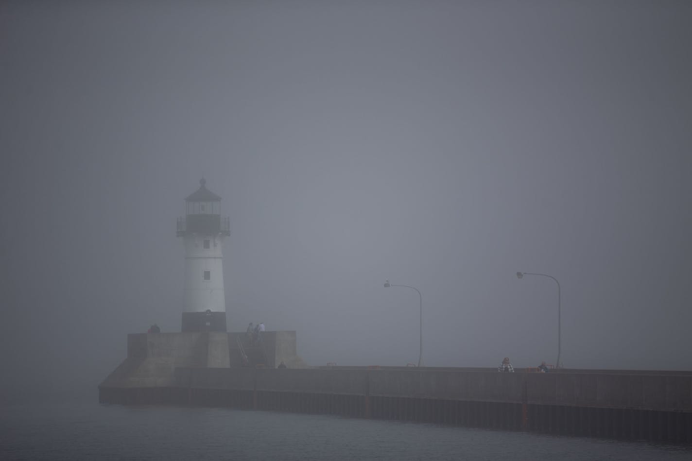 A thick fog covered the Duluth Harbor North Pier Light on Monday afternoon. The fog hung in the air late into the afternoon without ever fully clearing that day.