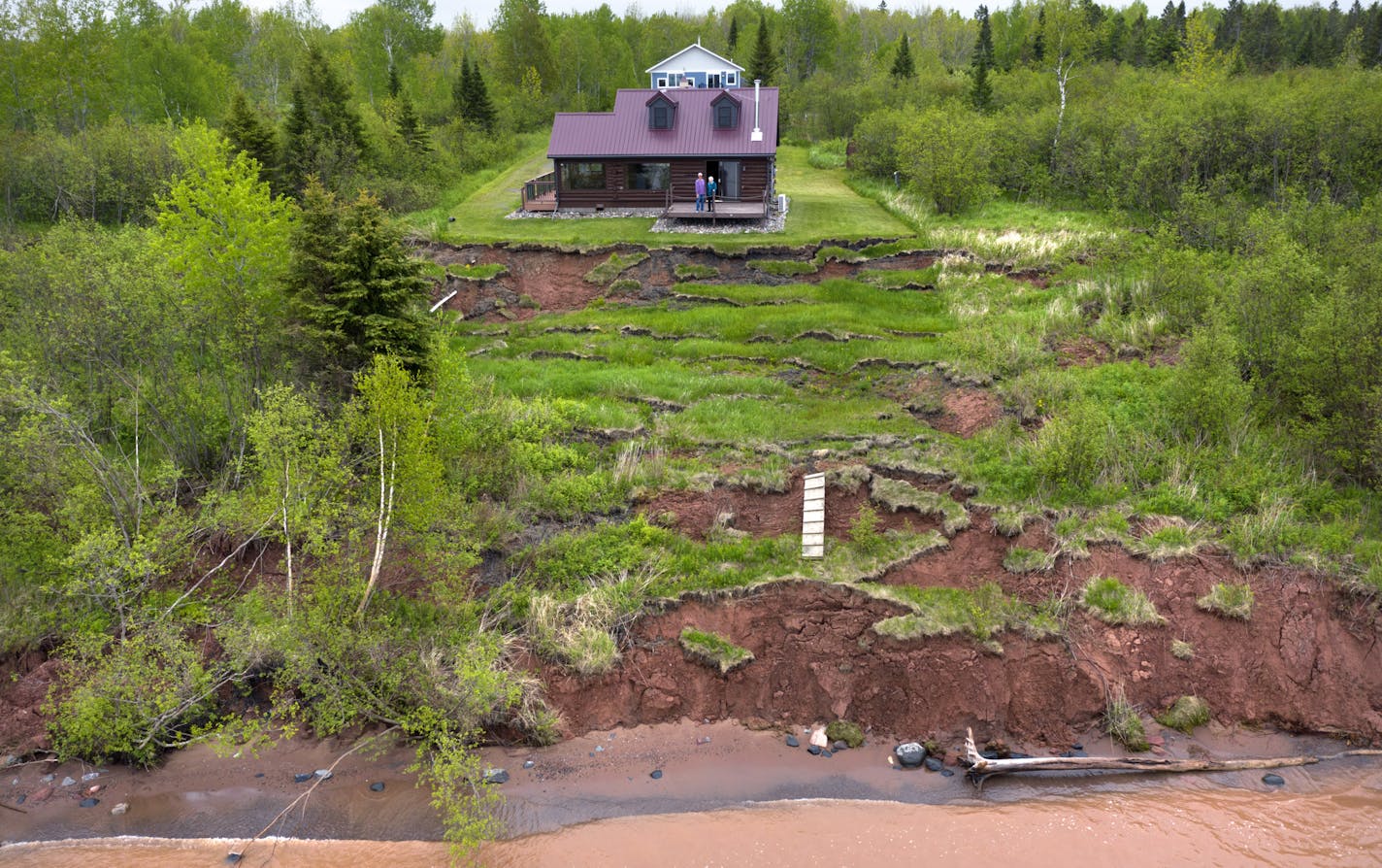 The shore has badly eroded in front of Mike and Kathy Briggs' log cabin on Lake Superior, so they chose to build a new structure farther back.