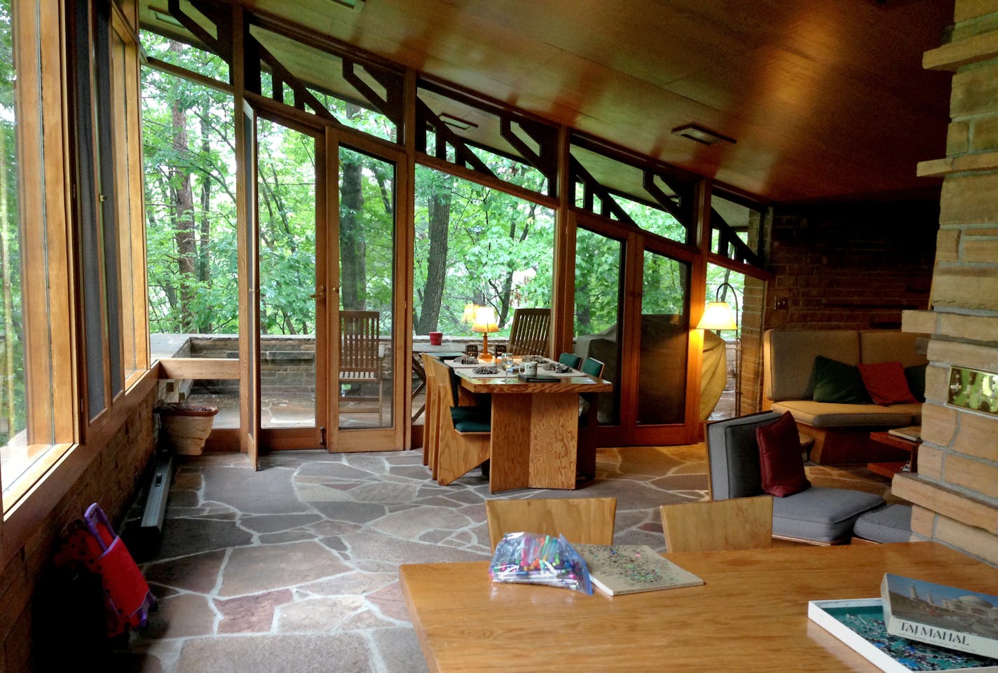 Inside the one-bedroom Seth Peterson Cottage, the furniture and woodwork have all been refurbished over the years, sticking close to Wright's original designs.