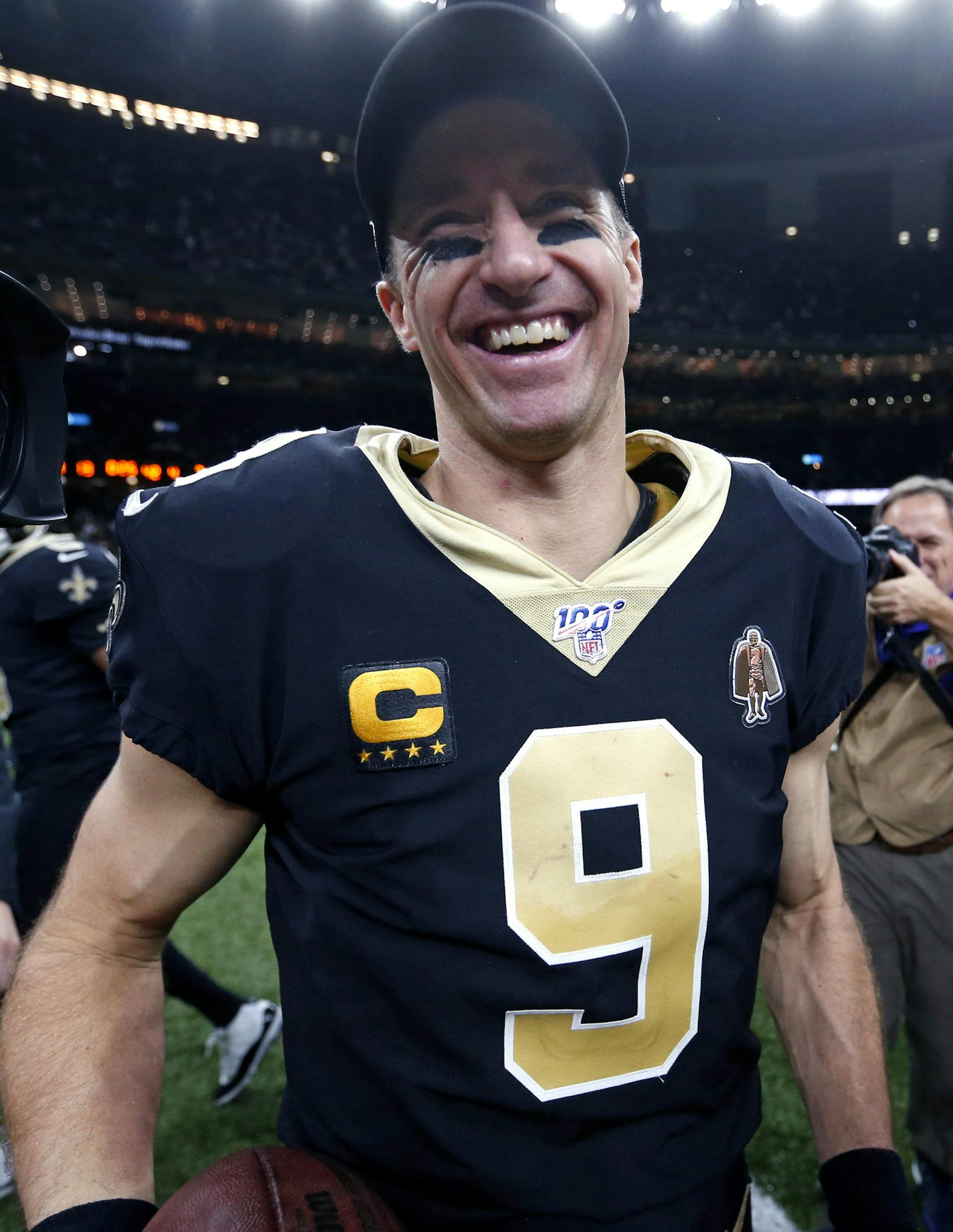 New Orleans Saints quarterback Drew Brees (9) smiles after defeating the Indianapolis Colts 34-7 in an NFL football game in New Orleans, Monday, Dec. 16, 2019. Brees broke the NFL record for career touchdown passes, surpassing Peyton Manning, and the all-time single game completion percentage as well. (AP Photo/Butch Dill)