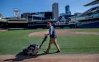 Ian Almquist, with the Twins grounds crew, mowed the lawn at Target Field on Friday. The Twins open the season from March 26-April 1 in Oakland and Se