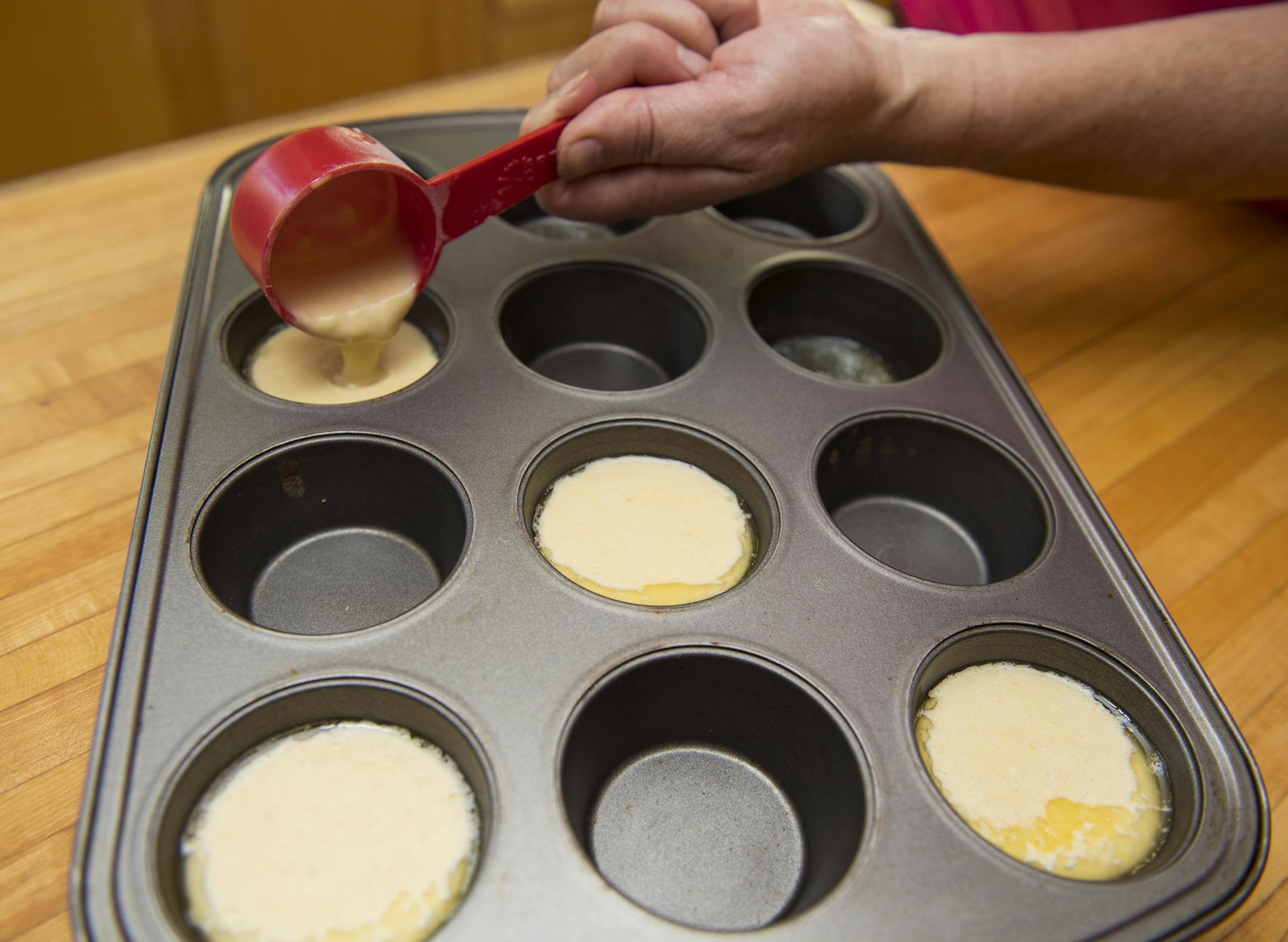 Step 6: Pour batter mix into muffin tin. Allow space between each Dutch Puff, they will expand in the oven. ] Isaac Hale ï isaac.hale@startribune.com Baking Central: Making Dutch Puffs in muffin tin and blueberry compote on Wednesday, July 13, 2016.