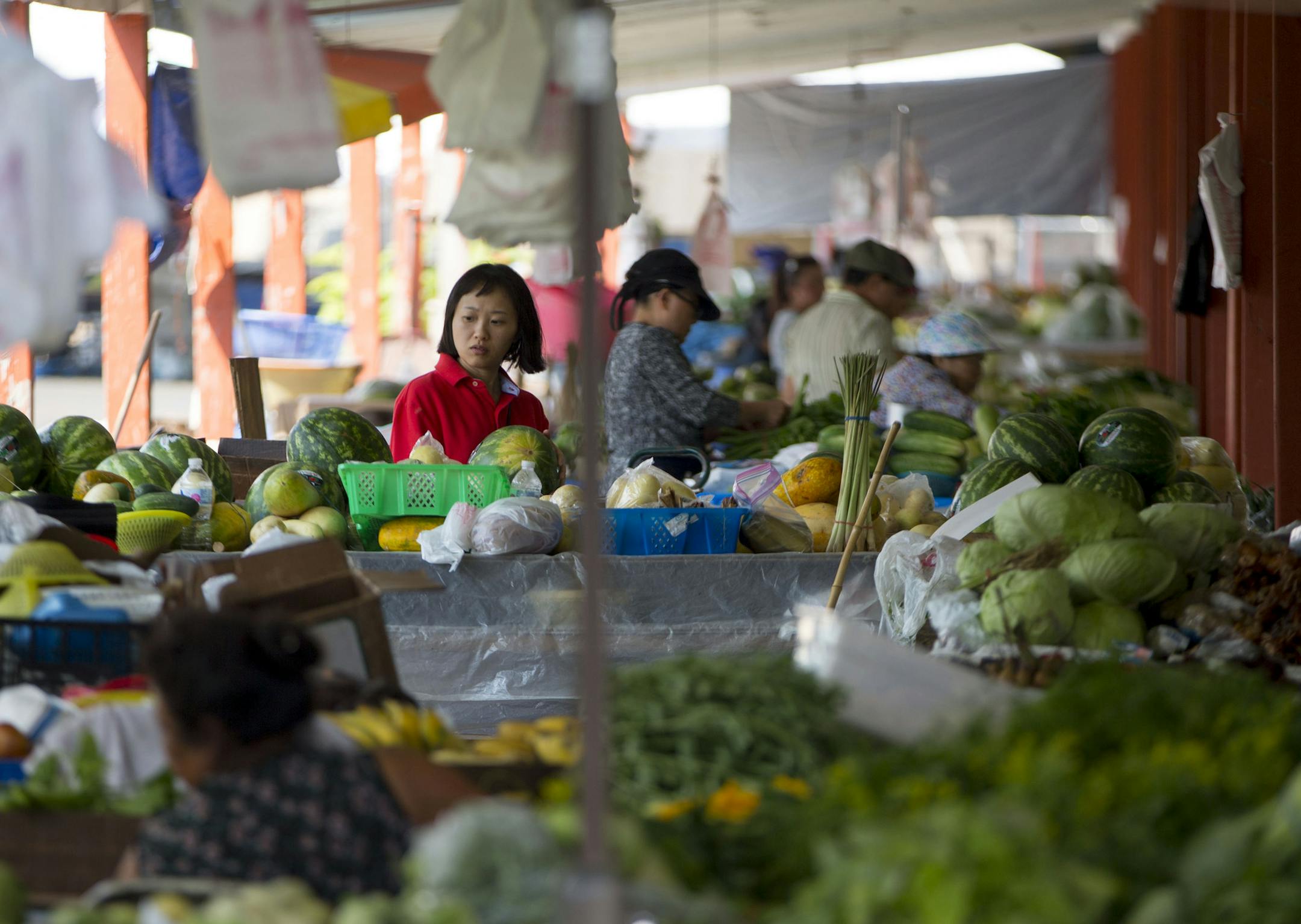 Dozens of vendors line the outdoor farmer's market section of the Hmongtown Market. ] ALEX KORMANN &#xa5; alex.kormann@startribune.com The Hmongtown Market is a local marketplace open every day of the year that sells locally grown produce as well as traditional Hmong food and cultural dress. There is an outdoor farmers market that sees vendors arrive as early as 6AM and stay until around 6PM. All are welcome to shop around and enjoy the fresh vegetables and even watch as they are washed and cut