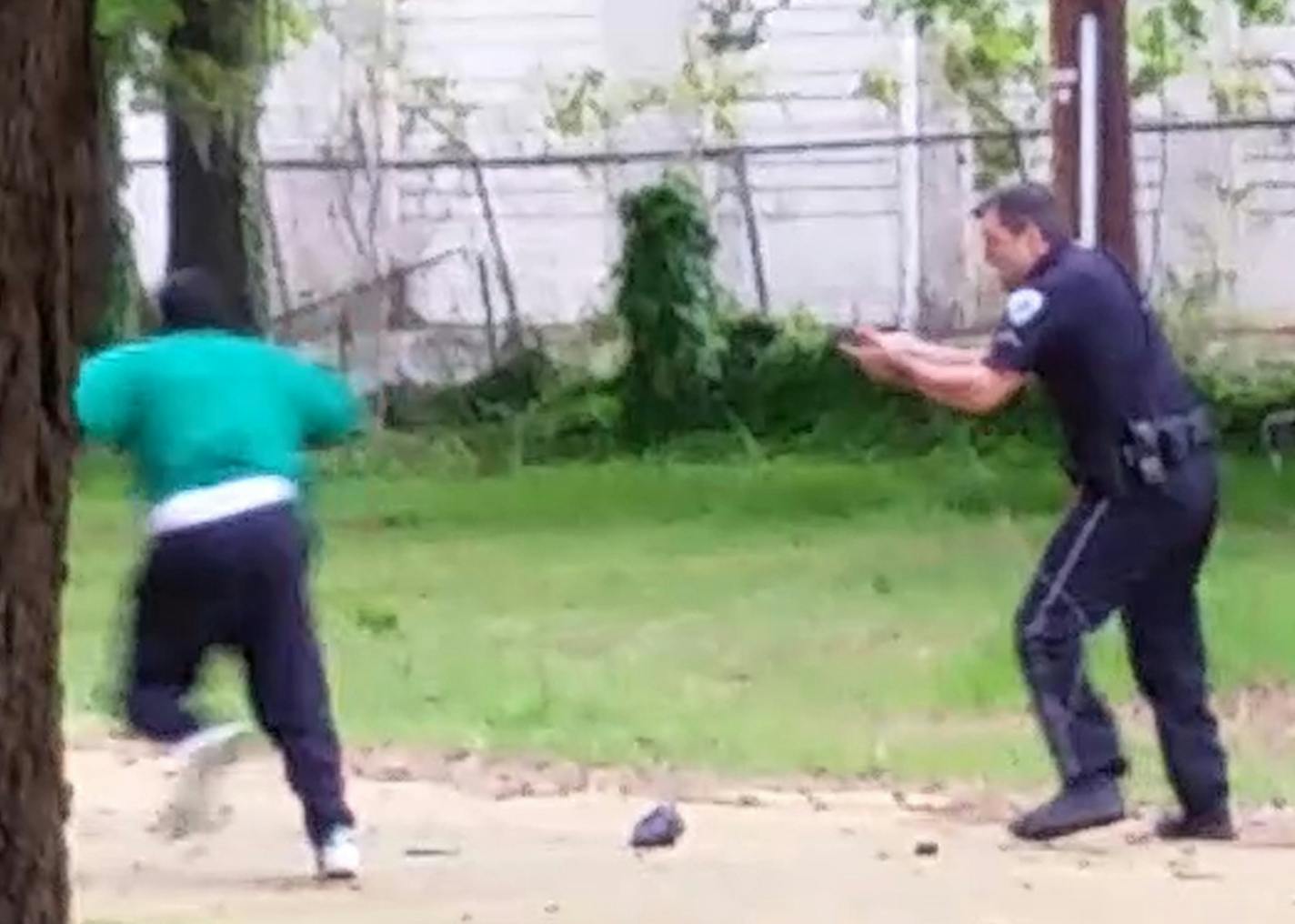 In this April 4, 2015, frame from video provided by Attorney L. Chris Stewart representing the family of Walter Lamer Scott, Scott appears to be running away from City Patrolman Michael Thomas Slager, right, in North Charleston, S.C.