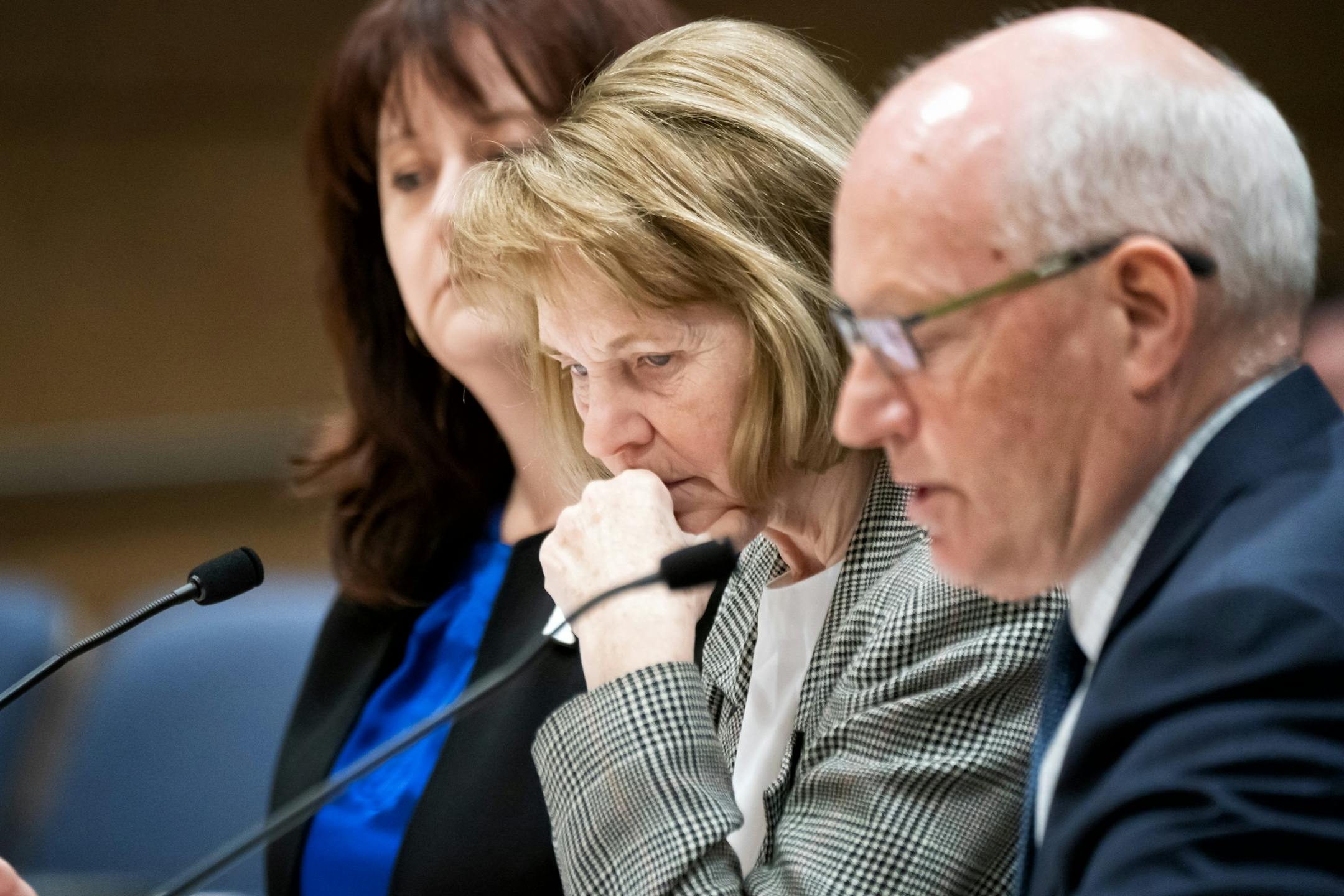 Senator Mary Kiffmeyer, R-Big Lake, listened as MMB Commissioner Myron Frans spoke about her Omnibus State Government Bill before the Senate Finance Committee. He objected to what he called arbitrary cuts and the arbitrary transfer of funds from necessary projects. On the left is State Auditor Julie Blaha.