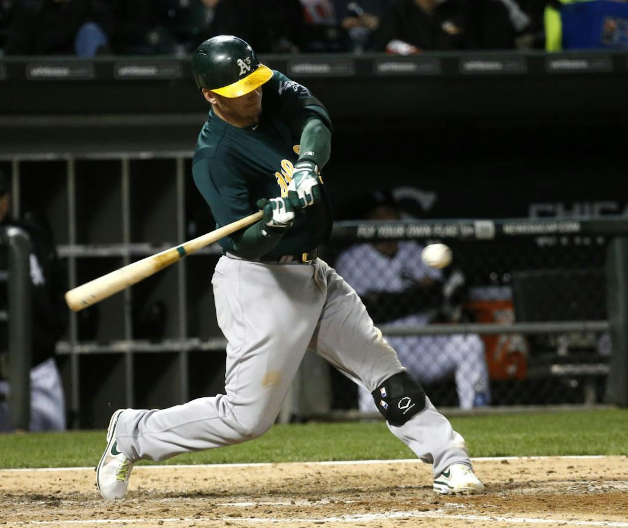 Oakland Athletics' Josh Donaldson hits a grand slam off Chicago White Sox starting pitcher Chris Sale during the sixth inning of a baseball game on Friday, June 7, 2013, in Chicago. Also scoring on the play were Yoenis Cespedes, Adam Rosales and Jed Lowrie.