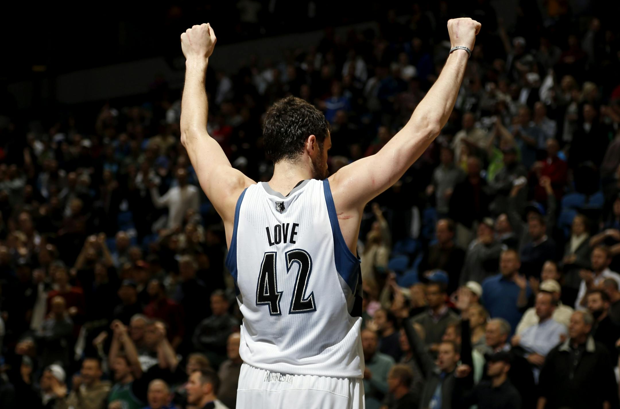 Kevin Love (42) celebrated at the end of the the Wolves' Opening Night victory over Orlando.