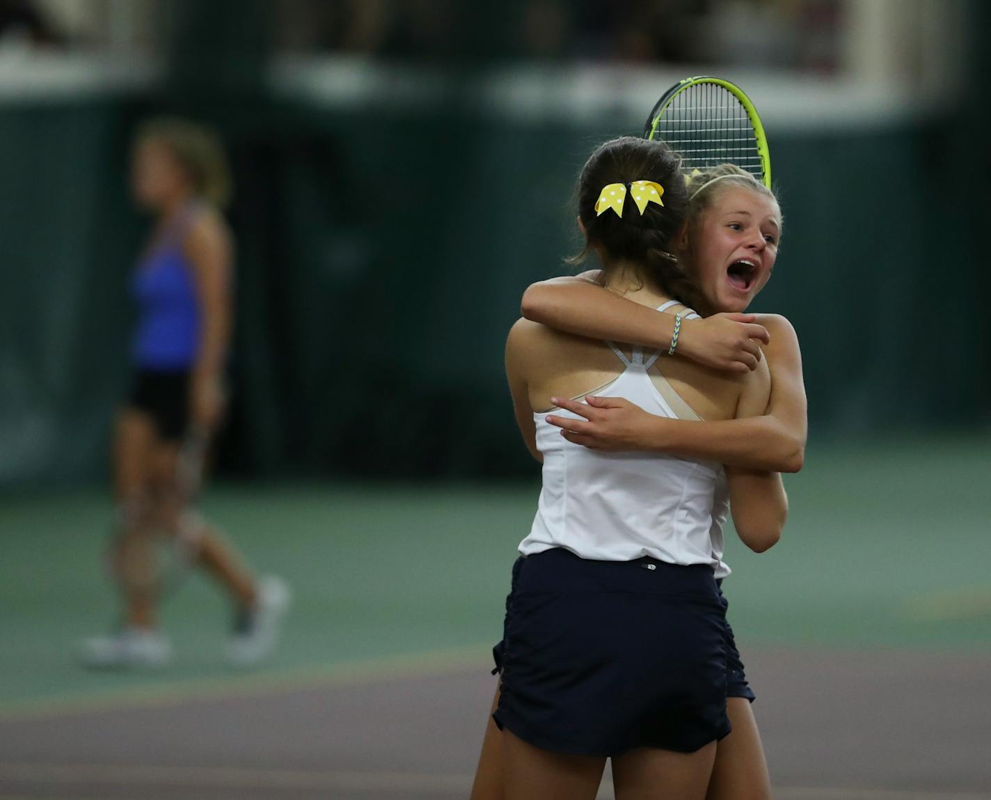 Mahtomedi's Emily Fraser and Lauren Splett, facing camera, celebrated their 6-0, 6-2 No. 2 doubles match win over Eagan. (Jeff Wheeler, Star Tribune)