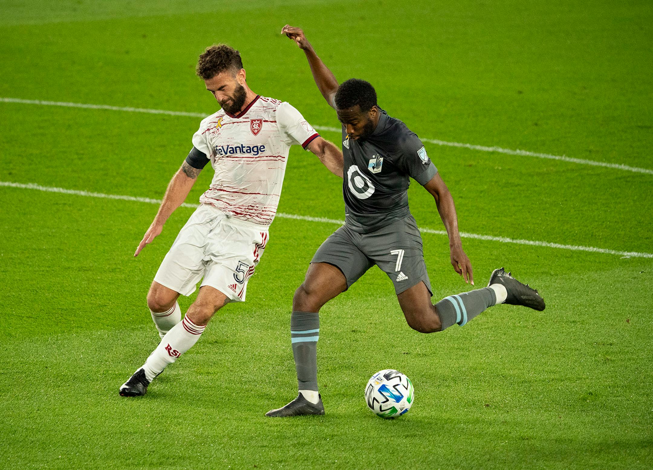 Minnesota United midfielder Kevin Molino (7) took a first half shot while defended by Real Salt Lake midfielder Kyle Beckerman (5).