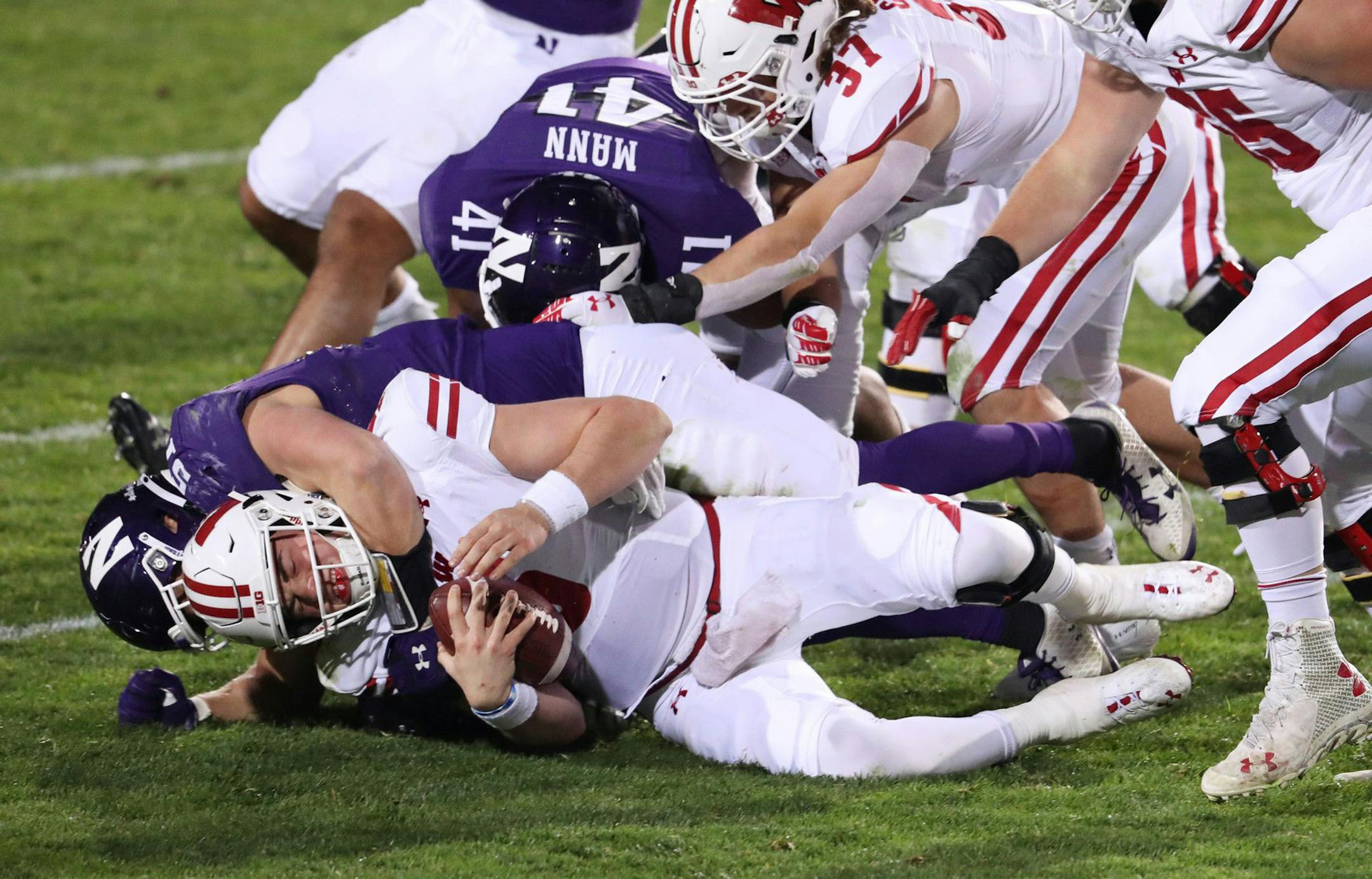 Northwestern linebacker Blake Gallagher (51) sacks Wisconsin quarterback Graham Mertz in the fourth quarter Saturday