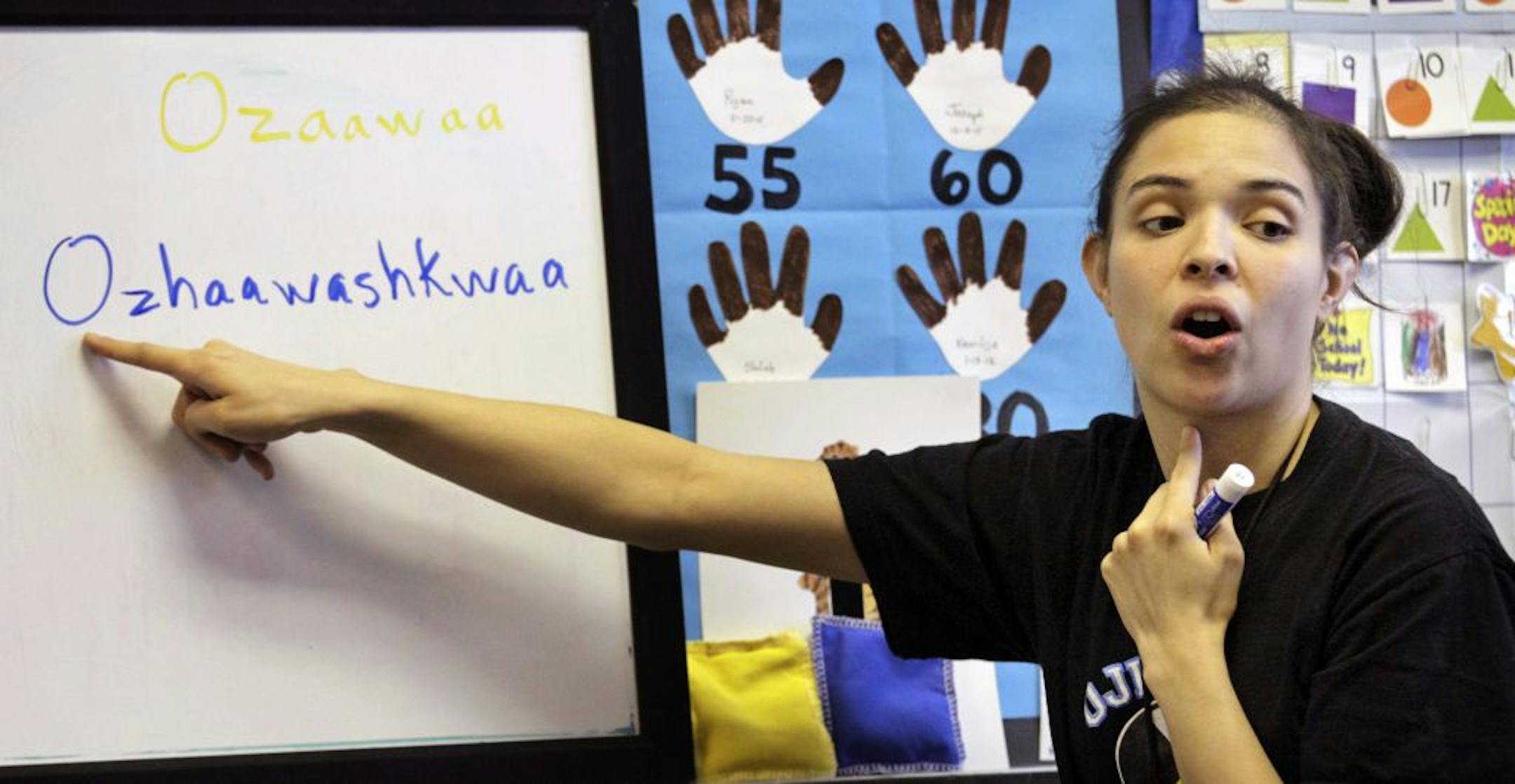 Children at Anishinabe Academy, a Minneapolis Magnet School focusing on high academic achievement through Native American culture and language. Here, Ogimaawaatigookwe "Ogi" Ruel practices Ojibwe language with pre-K students.