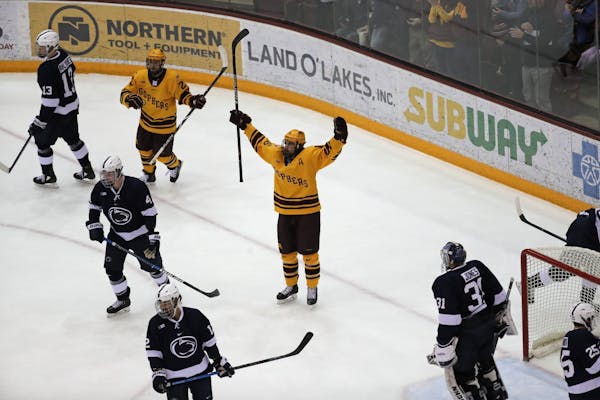 Minnesota Golden Gophers right wing Jack Ramsey (16) celebrated after scoring in the second period.