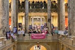 Protesters on both sides of the abortion debate pack the halls outside the state Senate chamber on Jan. 27 in St. Paul. 