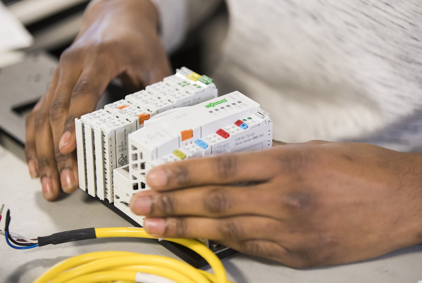 Kamonty Wade works on building an ethernet hub box at Rudolph Technologies. ] LEILA NAVIDI &#xef; leila.navidi@startribune.com BACKGROUND INFORMATION: Kamonty Wade, a Summit Academy graduate, works at Rudolph Technologies in Bloomington on Friday, March 17, 2017. In 2012, the Minnesota Department of Human Rights raised the requirement for workforce diversity on public construction projects from 11 percent workers of color to 32 percent workers of color. Minneapolis and other jurisdictions have g