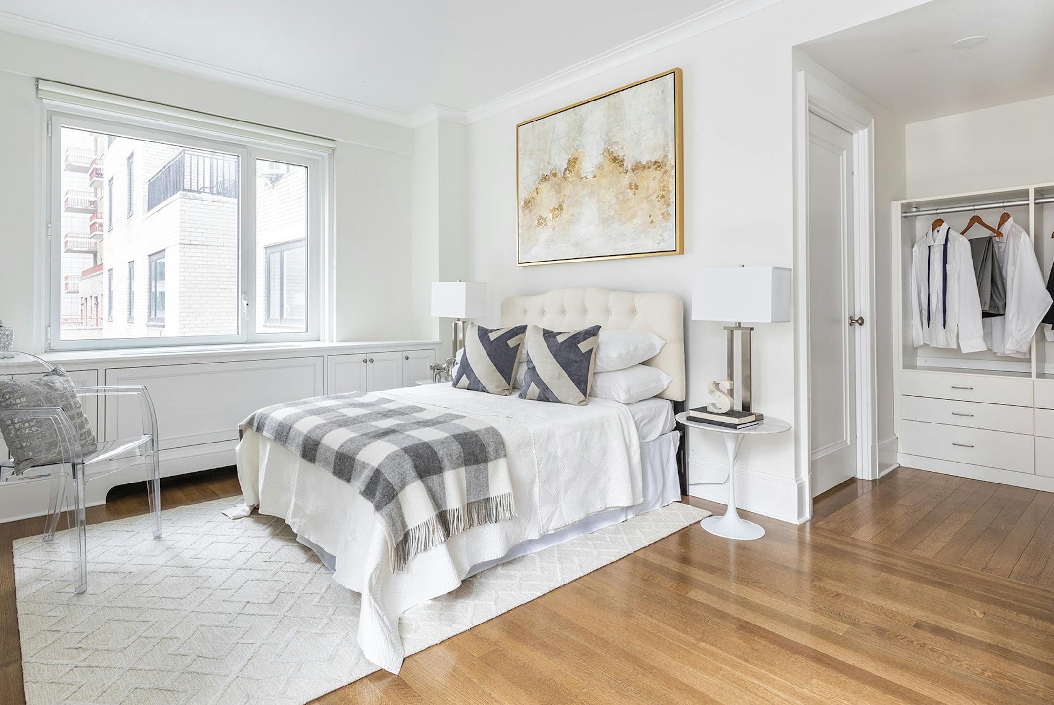 A headboard is dressed up with an extended drop bed skirt and oversized duvet.