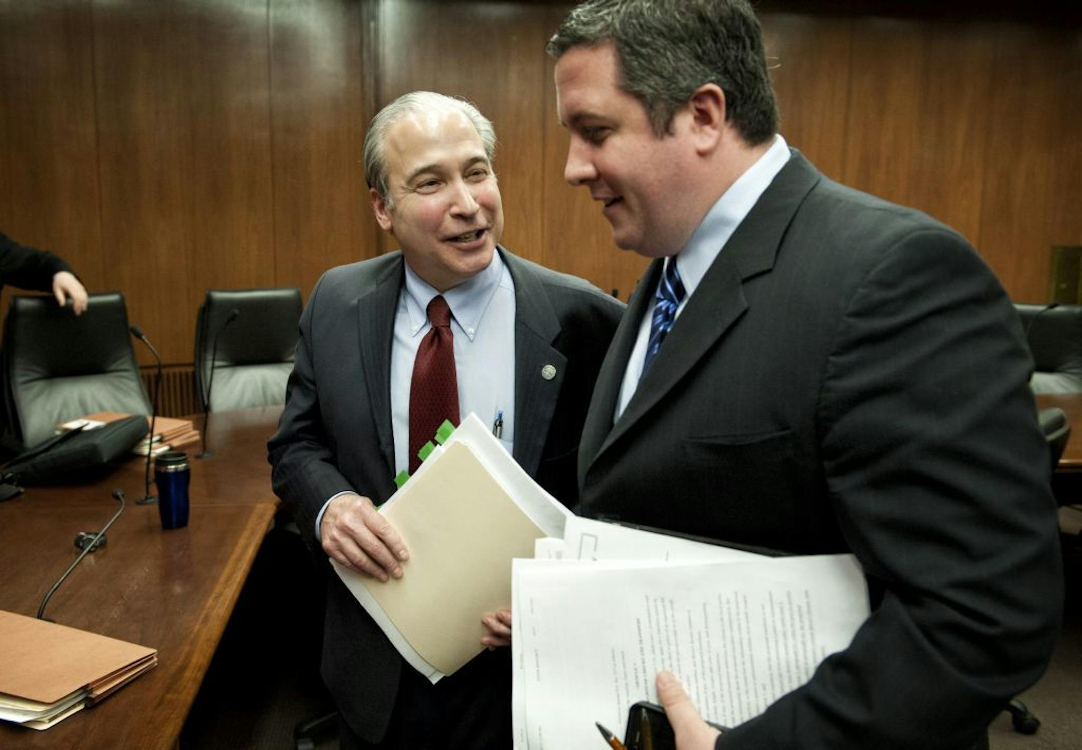 After the hearing Christopher Rager, right, of the NRA institute for legislative action talked with bill author Rep. Michael Paymar. Earlier Rager charged that Rep. Paymar was bullying DFL members of the committee who were wavering in support of his bill but were supporting a compromise bill without background checks. Supporters of universal background checks for guns faced a stiff test in House public safety committee Tuesday, March 19, 2013. The bill containing background checks may not have t