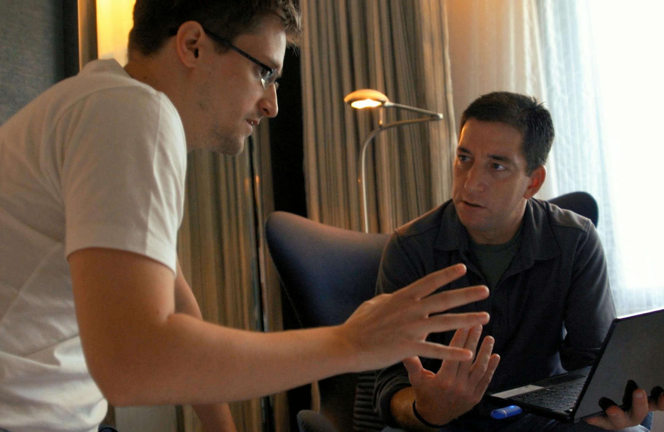 In this image released by Radius TWC, Edward Snowden, left, appears with Glenn Greenwald in a scene from "Citizenfour," a documentary that intimately captures Snowden during his leak of NSA documents. The film is nominated for an Oscar for documentary feature. The Academy of Motion Picture Arts and Sciences honors the documentary nominees Wednesday, Feb. 18, 2015, ahead of the 87th annual Academy Awards, in Los Angeles. (AP Photo/Radius TWC)
