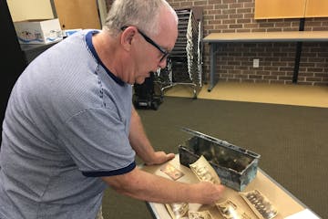 Beatrice Dupuy &#xef; beatrice.dupuy@startribune.com
Dennis Dvorak, founder of the New Prague Historical Society, holds up a photo of the girls&#xed; 