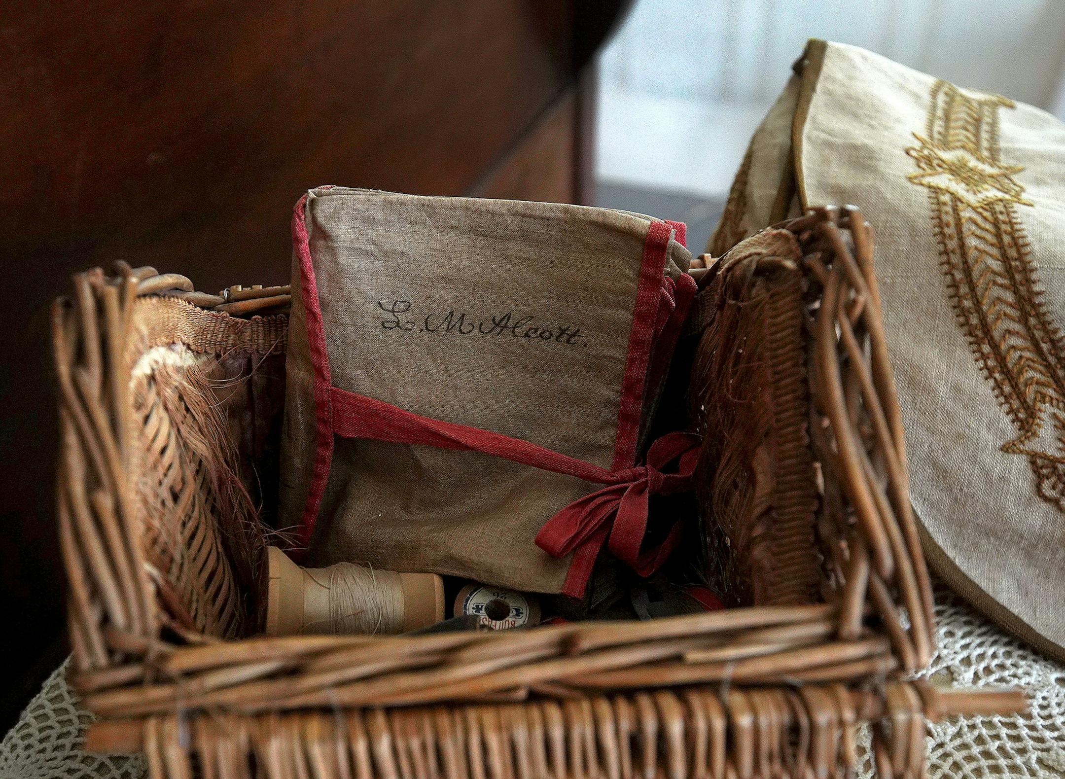 Louisa May Alcott's handwritten name is pictured on sewing kit materials on display at the Orchard House in Concord, Mass. on Sep. 11, 2018. (Barry Chin/The Boston Globe/Getty Images/TNS) ORG XMIT: 1561791